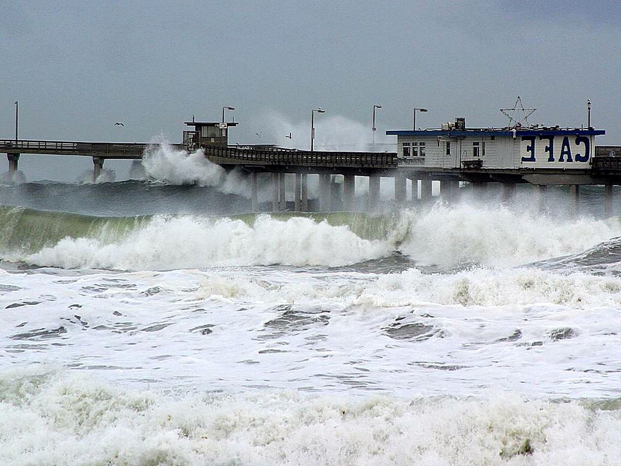 Image title: El nino waves piers ocean seagulls cafe