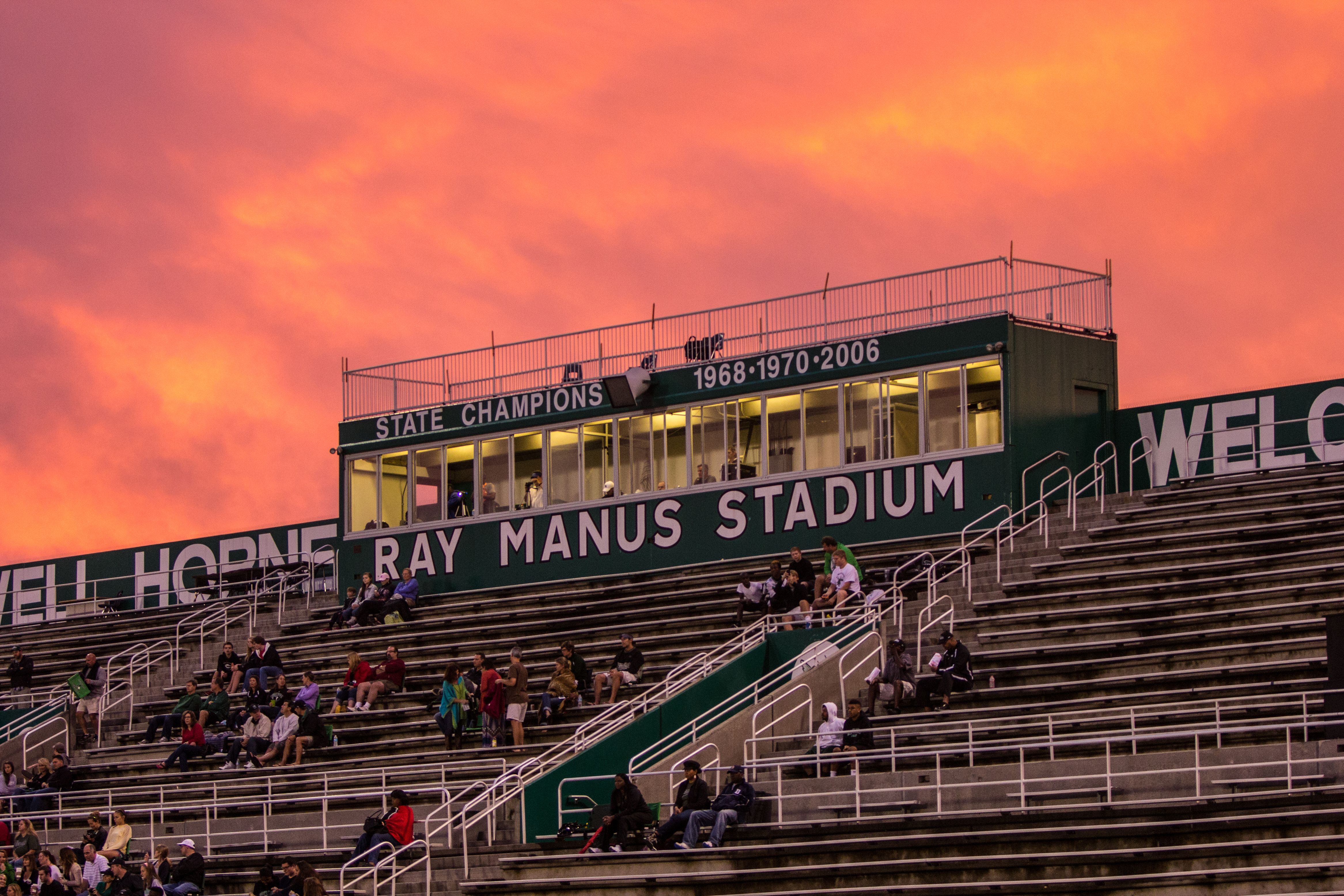 Stadium bleachers and press box with 'Ray Manus Stadium' signage at a high school.