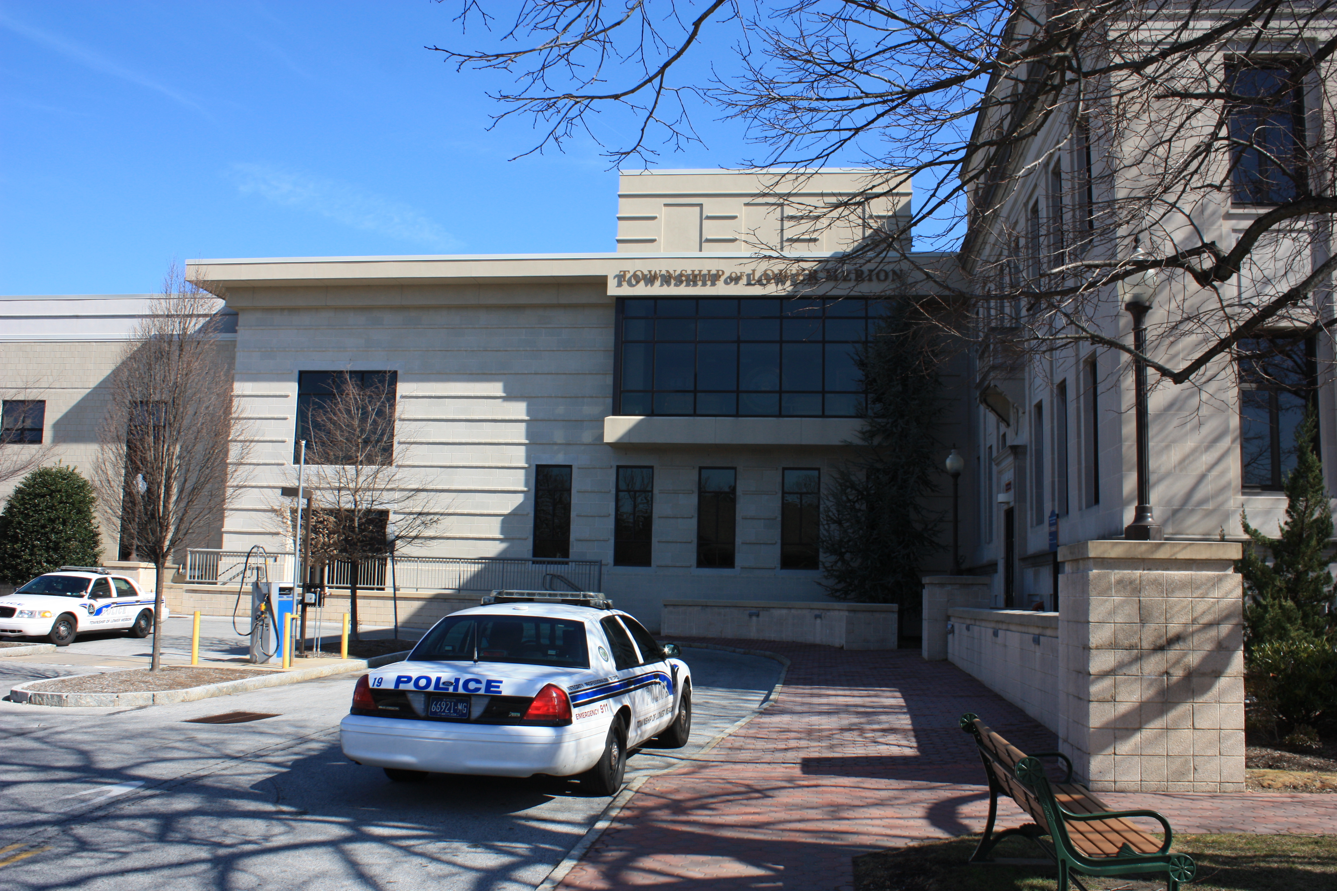 White police car parked in front of the Lower Merion Township municipal building.