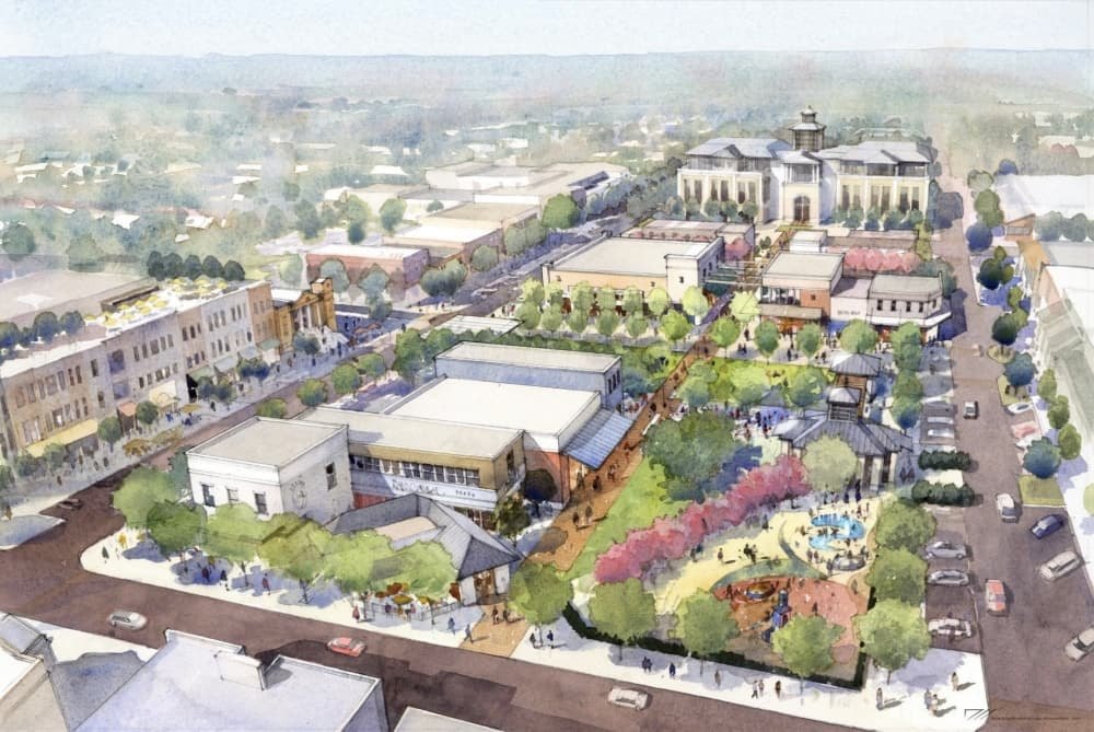 Watercolor-style aerial rendering of a planned downtown area with a civic building, green spaces, and pedestrian walkways.
