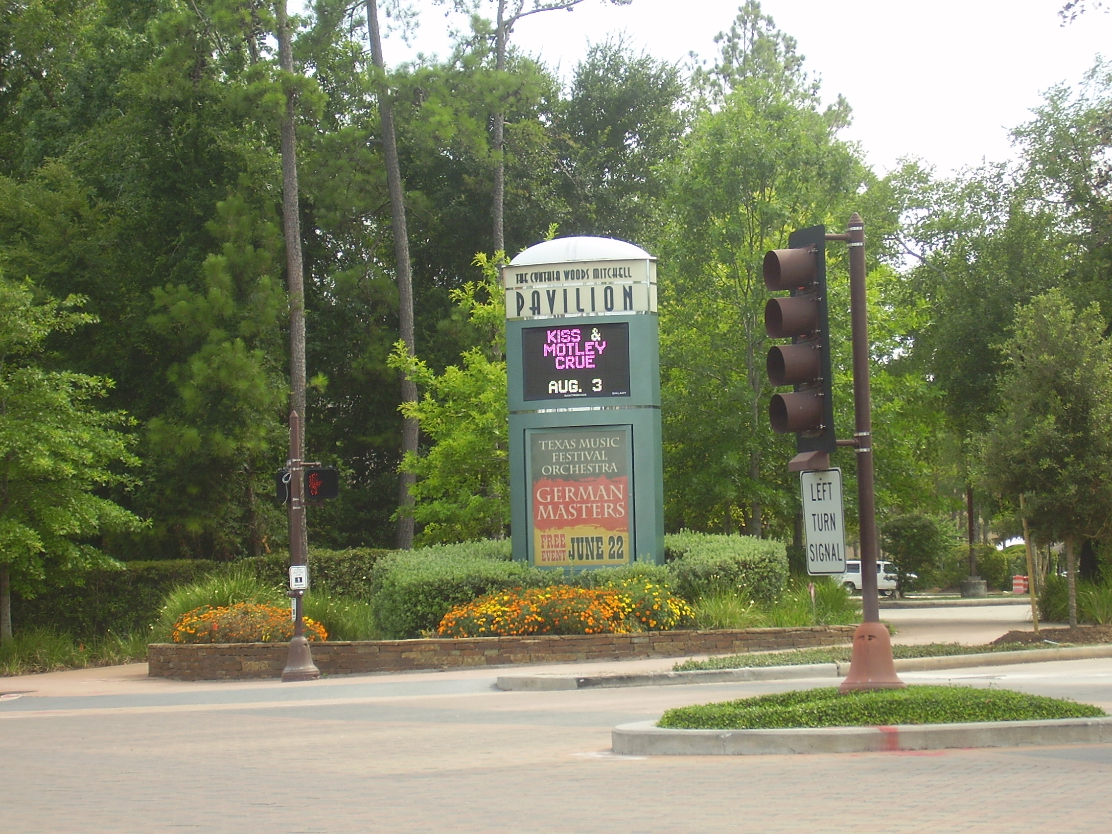Roadside marquee sign for an outdoor concert venue listing upcoming shows