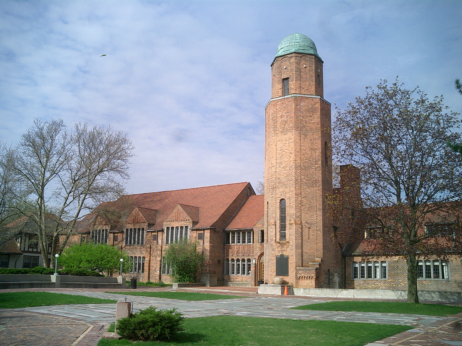 Red-brick tower with green copper dome at Cranbrook Kingswood School campus.