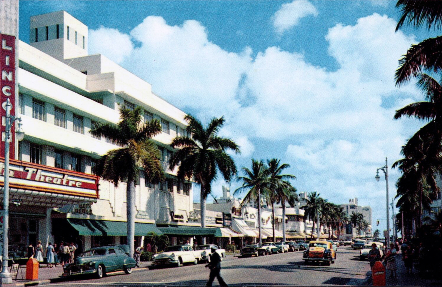 Vintage postcard showing Lincoln Road lined with Art Deco buildings and palm trees.