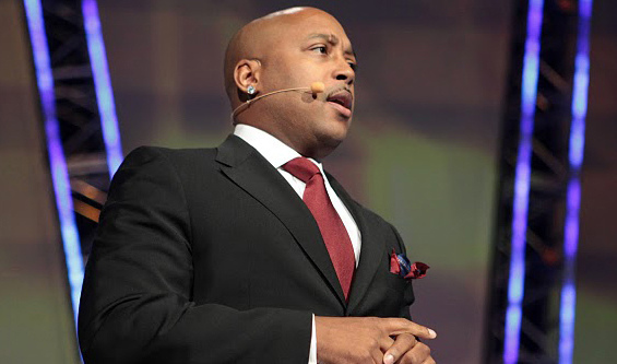 Photo of Daymond John, FUBU CEO, speaking at an event.