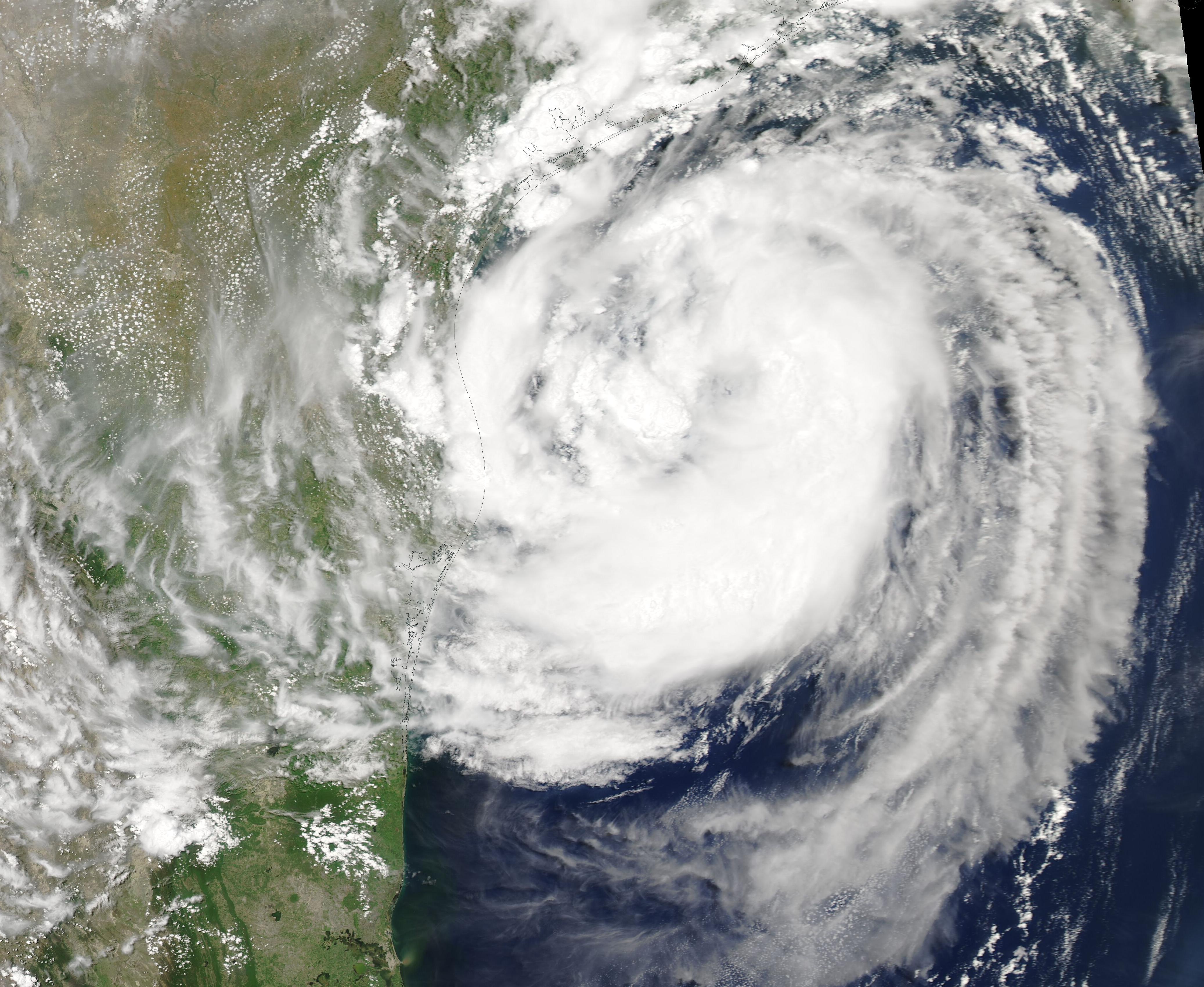 Satellite image of a hurricane's spiral cloud bands over the Gulf of Mexico near Texas.