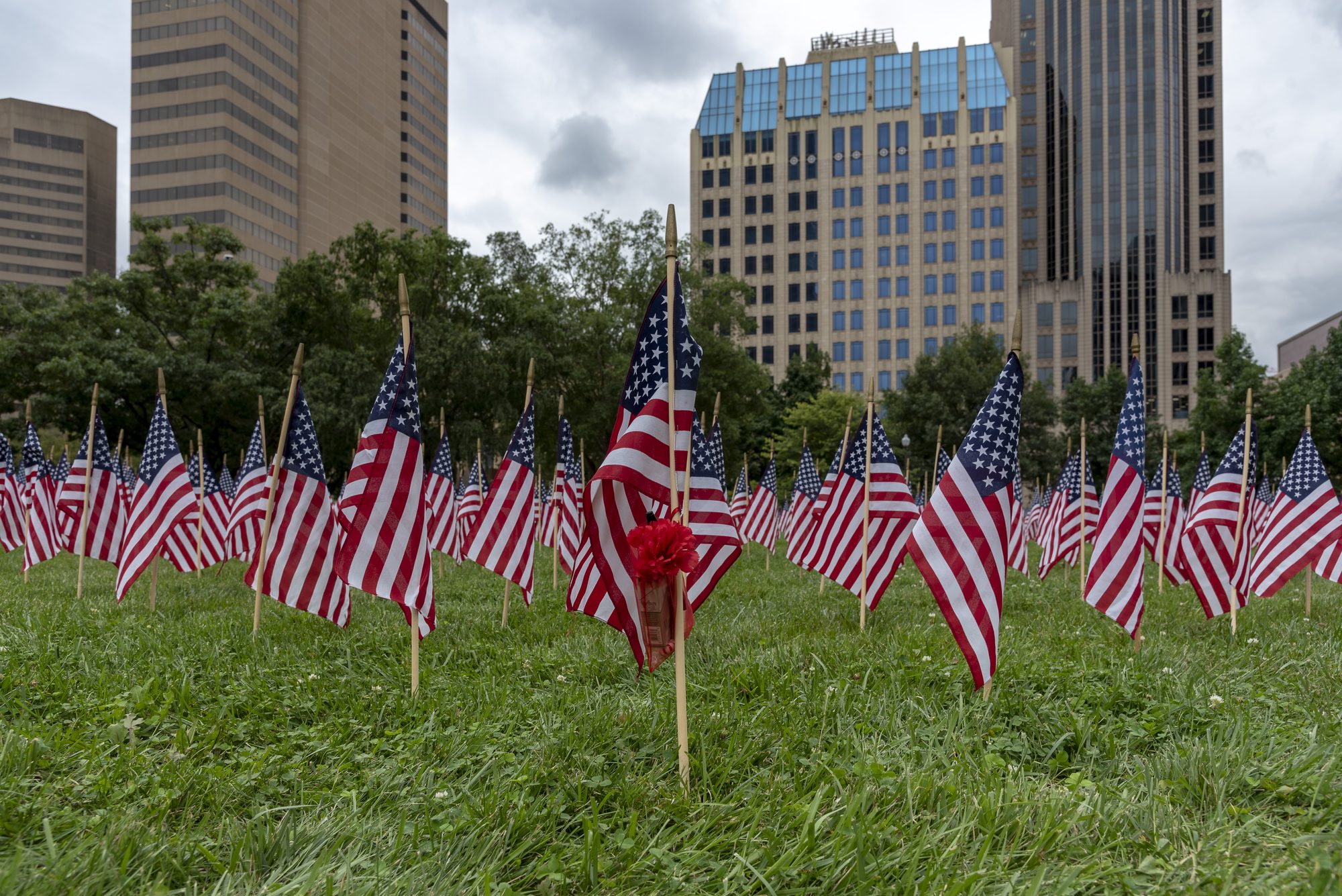 2,977 flags were placed on September 11th 2018 on the Ohio Statehouse lawn in memorial to an american life that was lost on this day in 2001. A simple memorial was left on this flag.