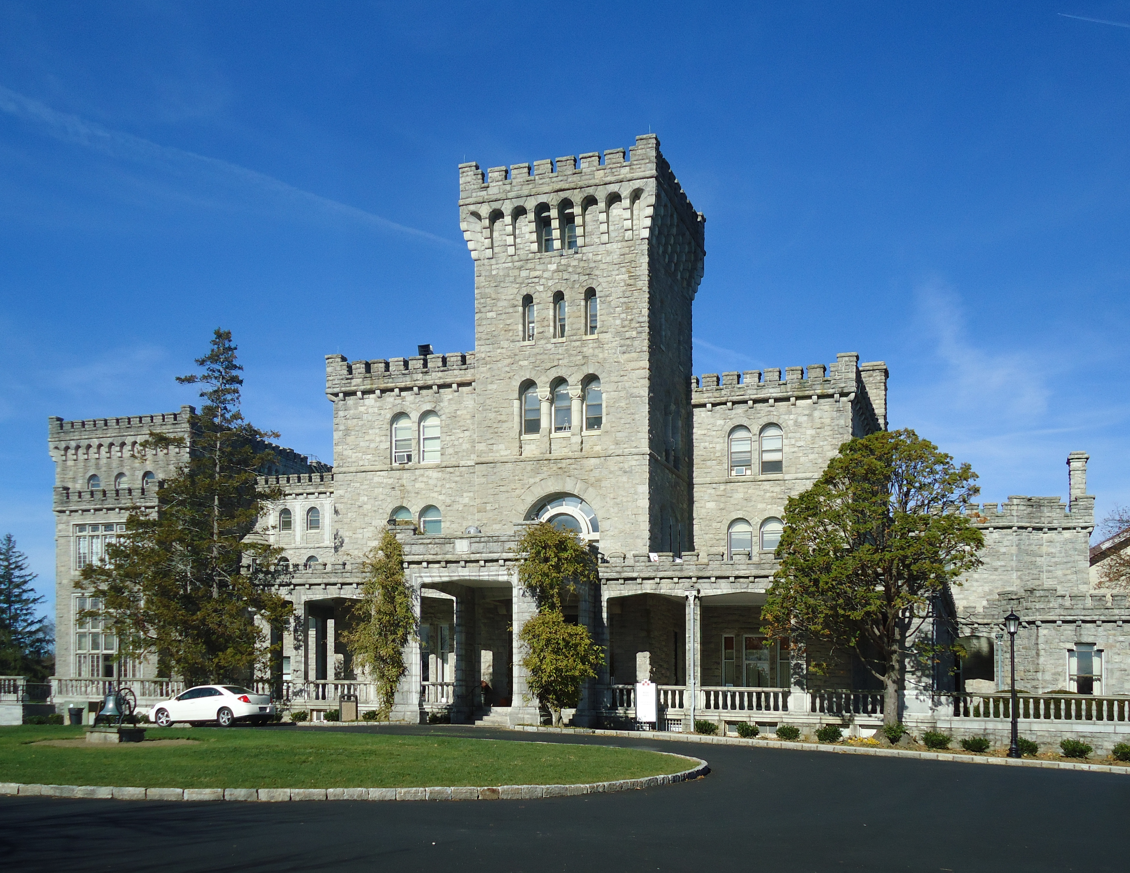 Exterior view of a brick and stone academic building on a university campus.