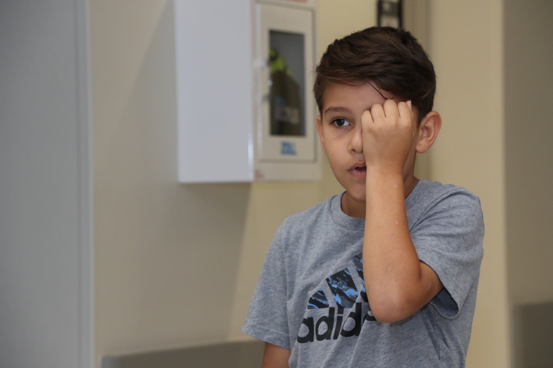 Ten-year-old Robert Bergdorf, son of U.S. Army Maj. Robert Bergdorf assigned to the 16th Sustainment Brigade in Baumholder, Germany, takes the vision test during a school and sports physical event, Aug. 10. The U.S. Army Health Clinic Baumholder hosted the event for all students in the Baumholder and Kaiserslautern Military Communities to receive last minute physicals prior to the start of Fall sports season. (U.S. Army photo by Gia Oney).
