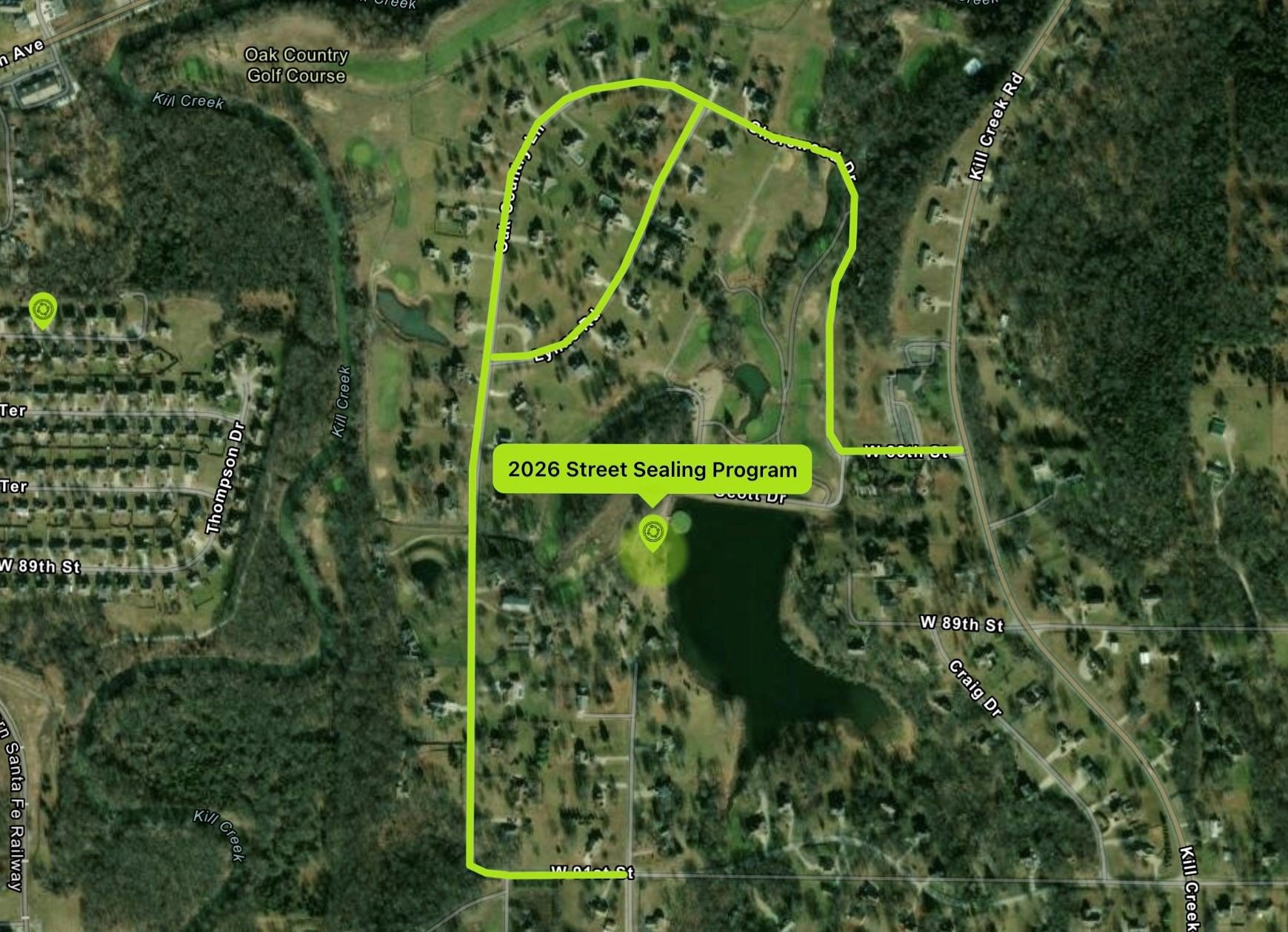 Satellite aerial map with a neon-green polygon marking a residential neighborhood project area.