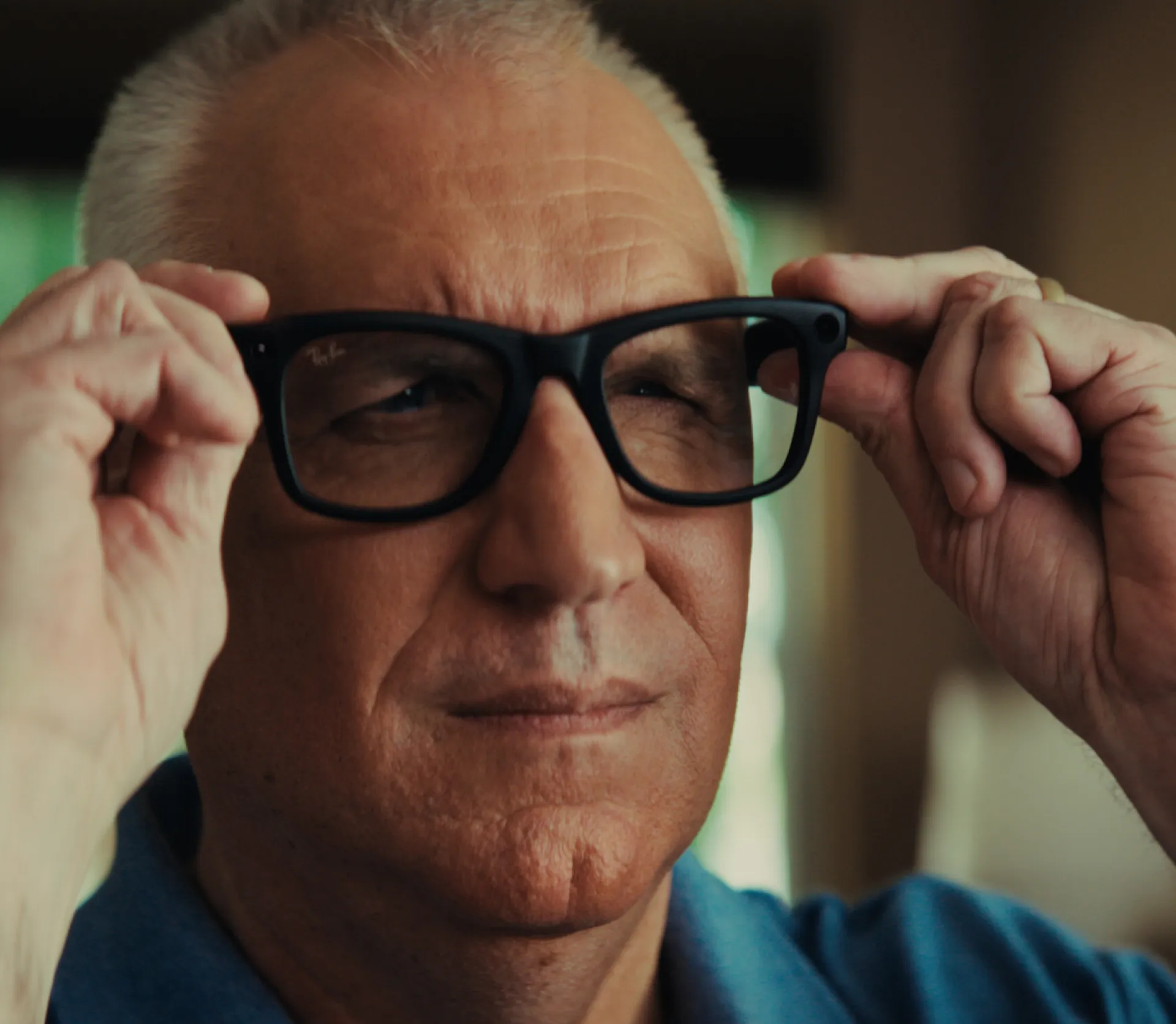 A blind war veteran tries on a pair of smart glasses.