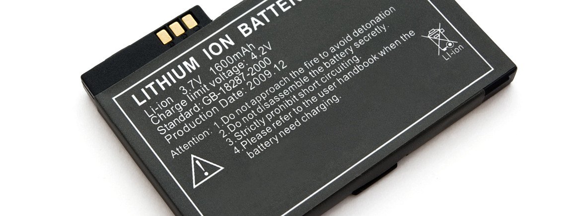 A black rectangular lithium-ion rechargeable battery with gold contact pins.
