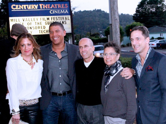 Five people pose in front of a cinema marquee reading Mill Valley Film Festival.