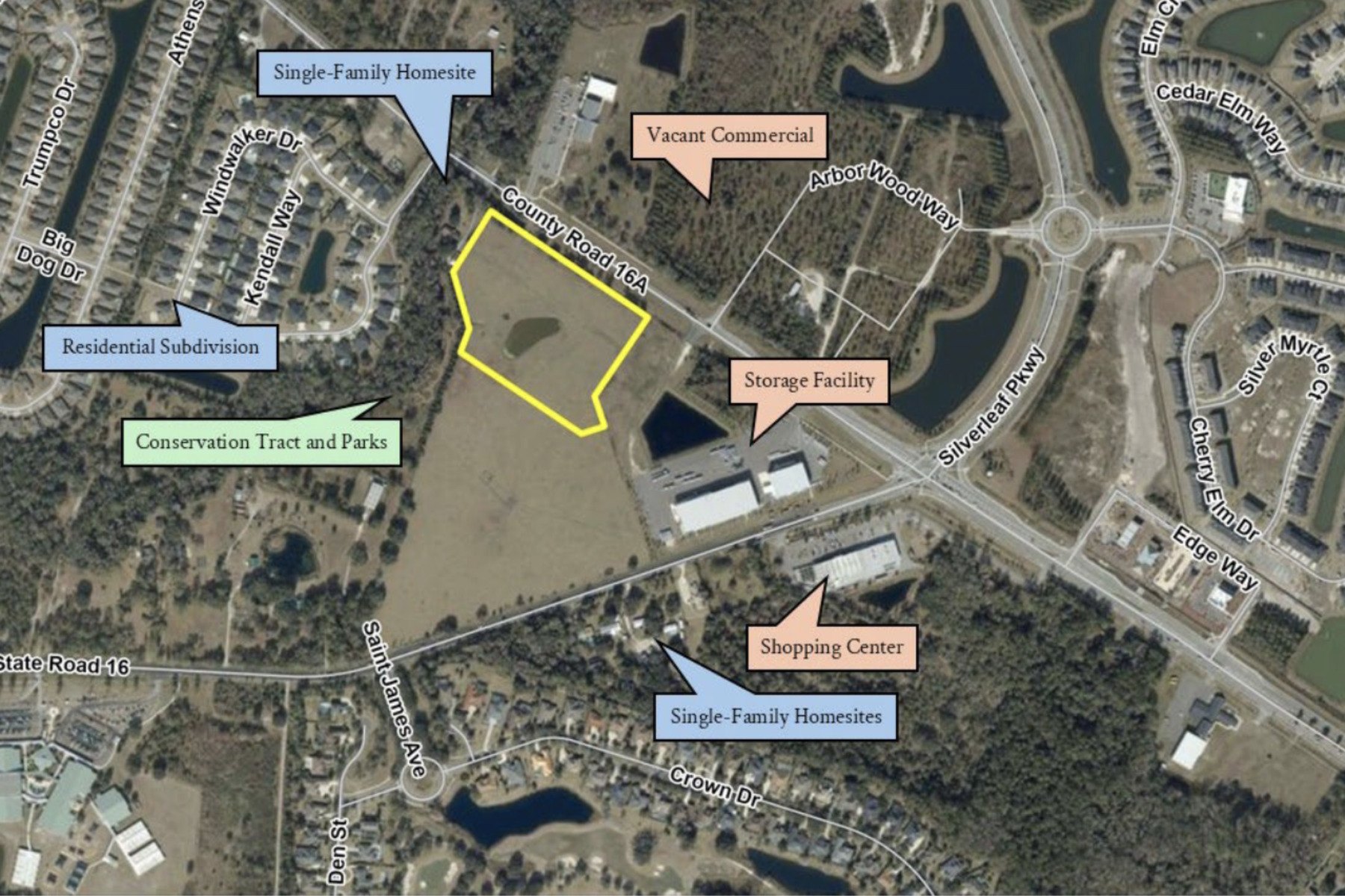 Aerial site map with a yellow-outlined parcel near a suburban road and surrounding labeled land uses.