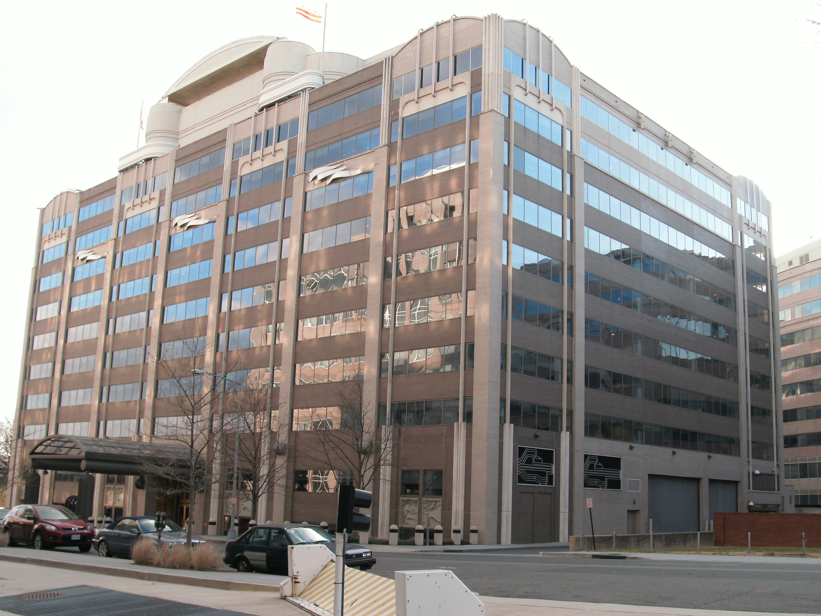 Exterior of the FCC headquarters building with curved roofline and glass windows.