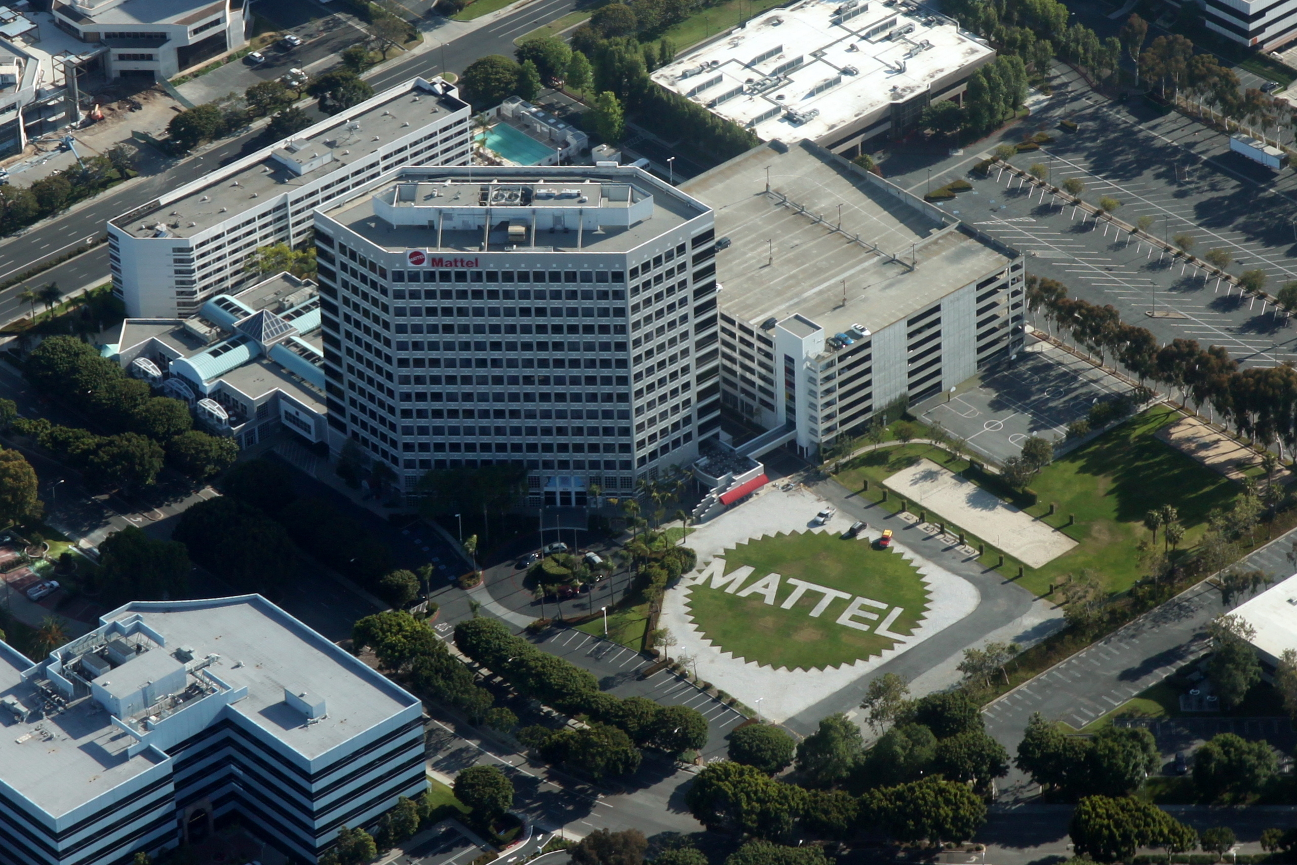 Aerial view of a large corporate campus with the word Mattel spelled out in front landscaping.