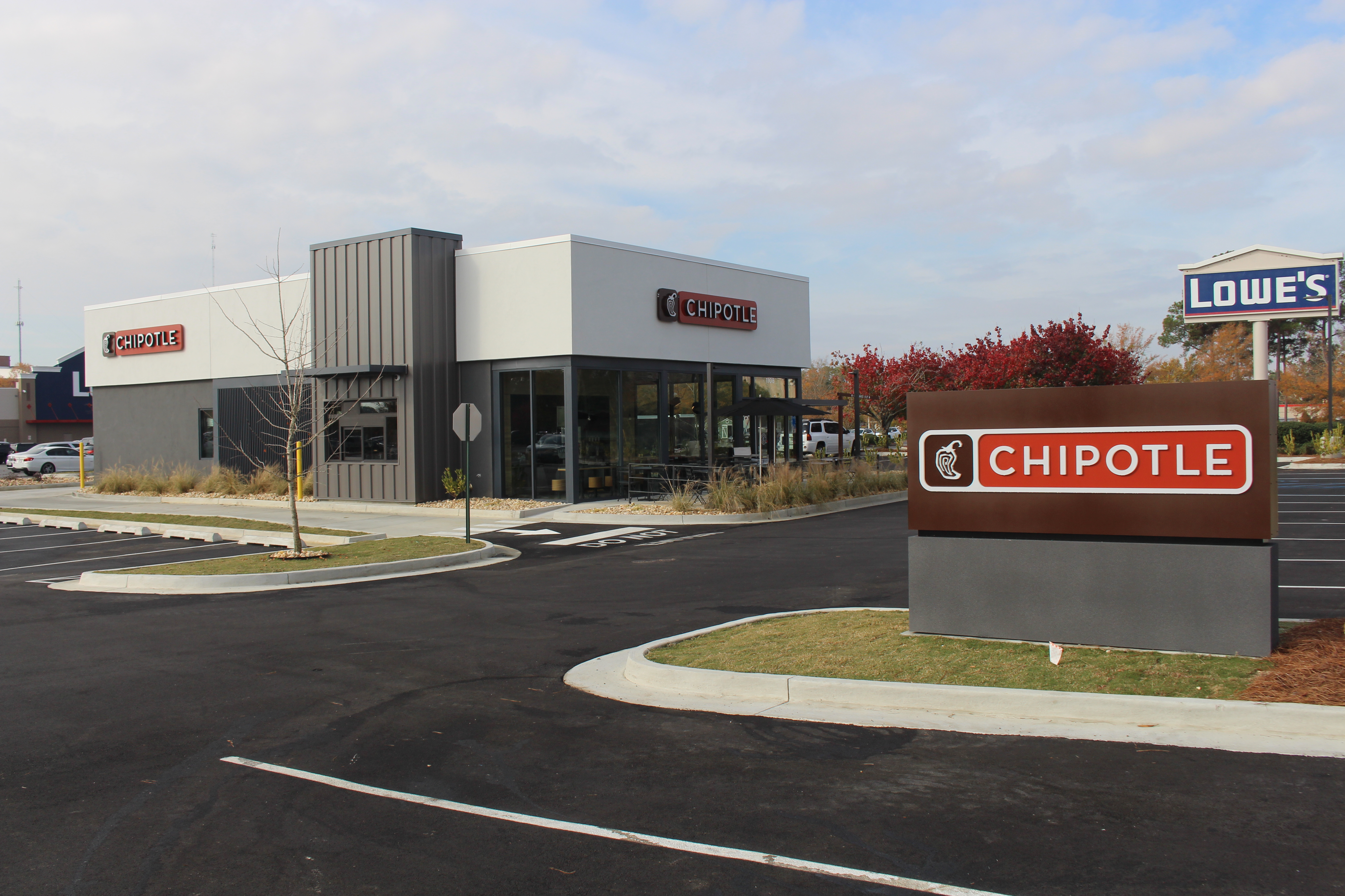 Chipotle Mexican Grill restaurant exterior with branded signage and parking lot.