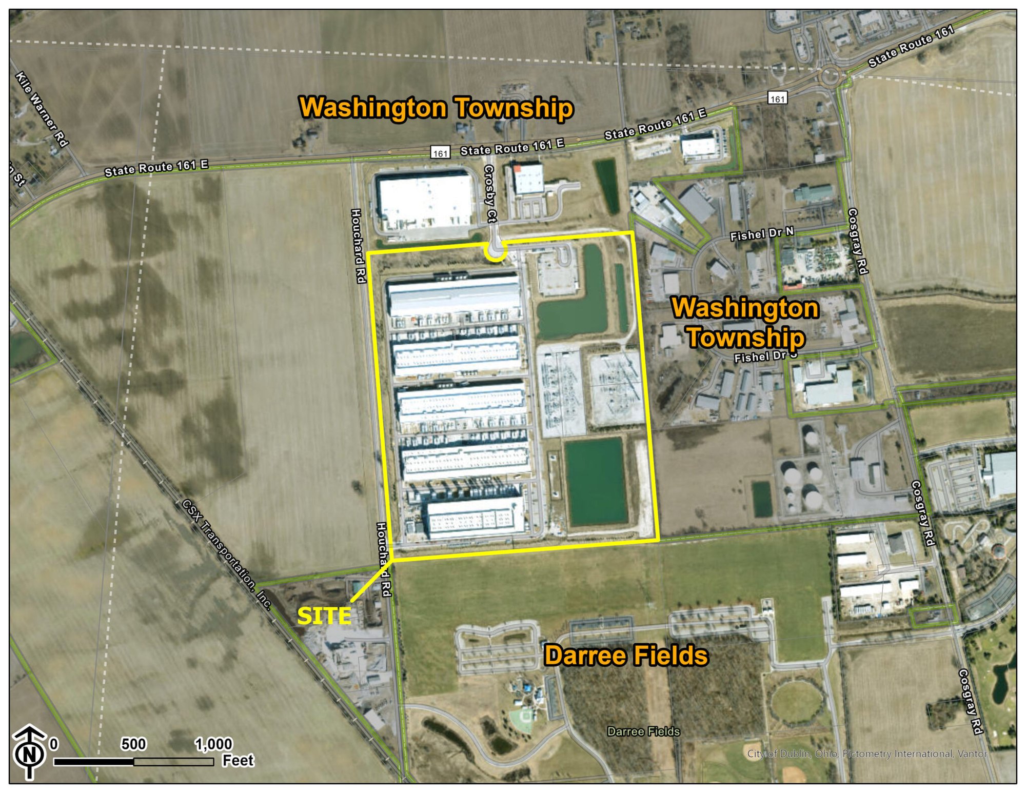 Aerial satellite map with yellow boundary outlining a large industrial campus near a road.
