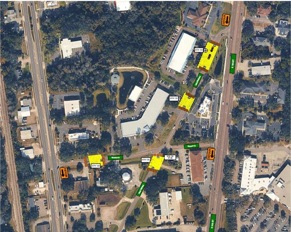 Annotated aerial map of a neighborhood with highlighted road segments and orange markers.