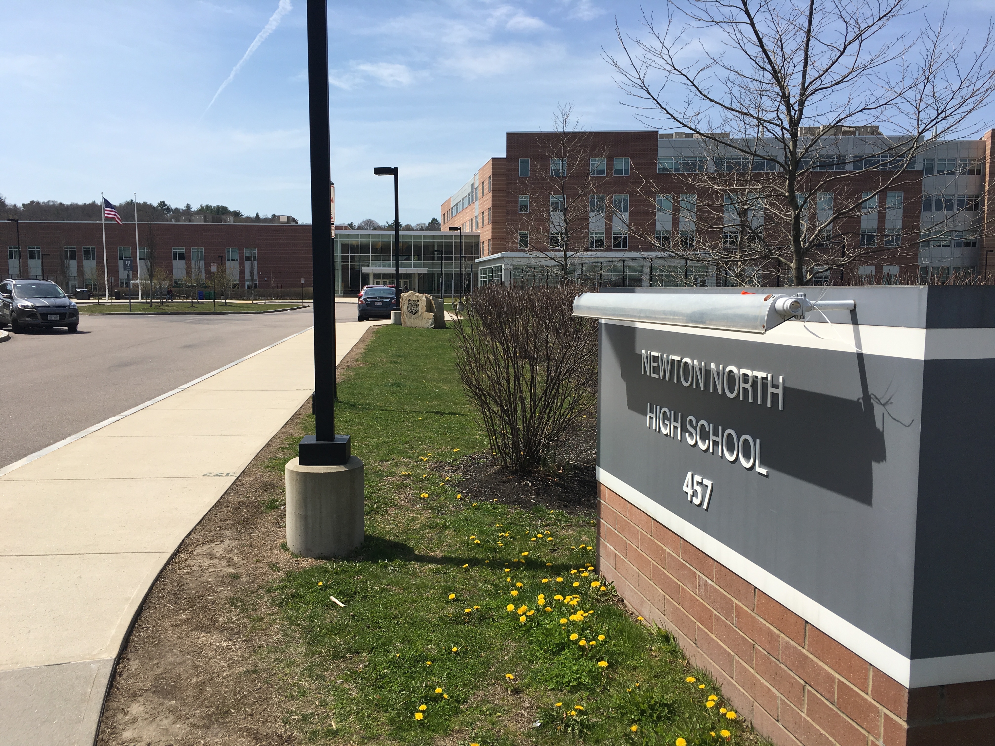 Entrance sign and brick facade of Newton North High School.