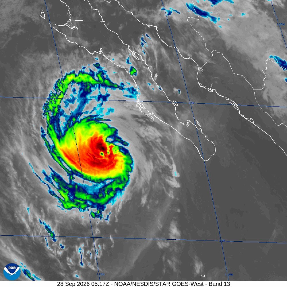 Infrared satellite image showing a tropical cyclone with a visible eye over the Pacific Ocean.