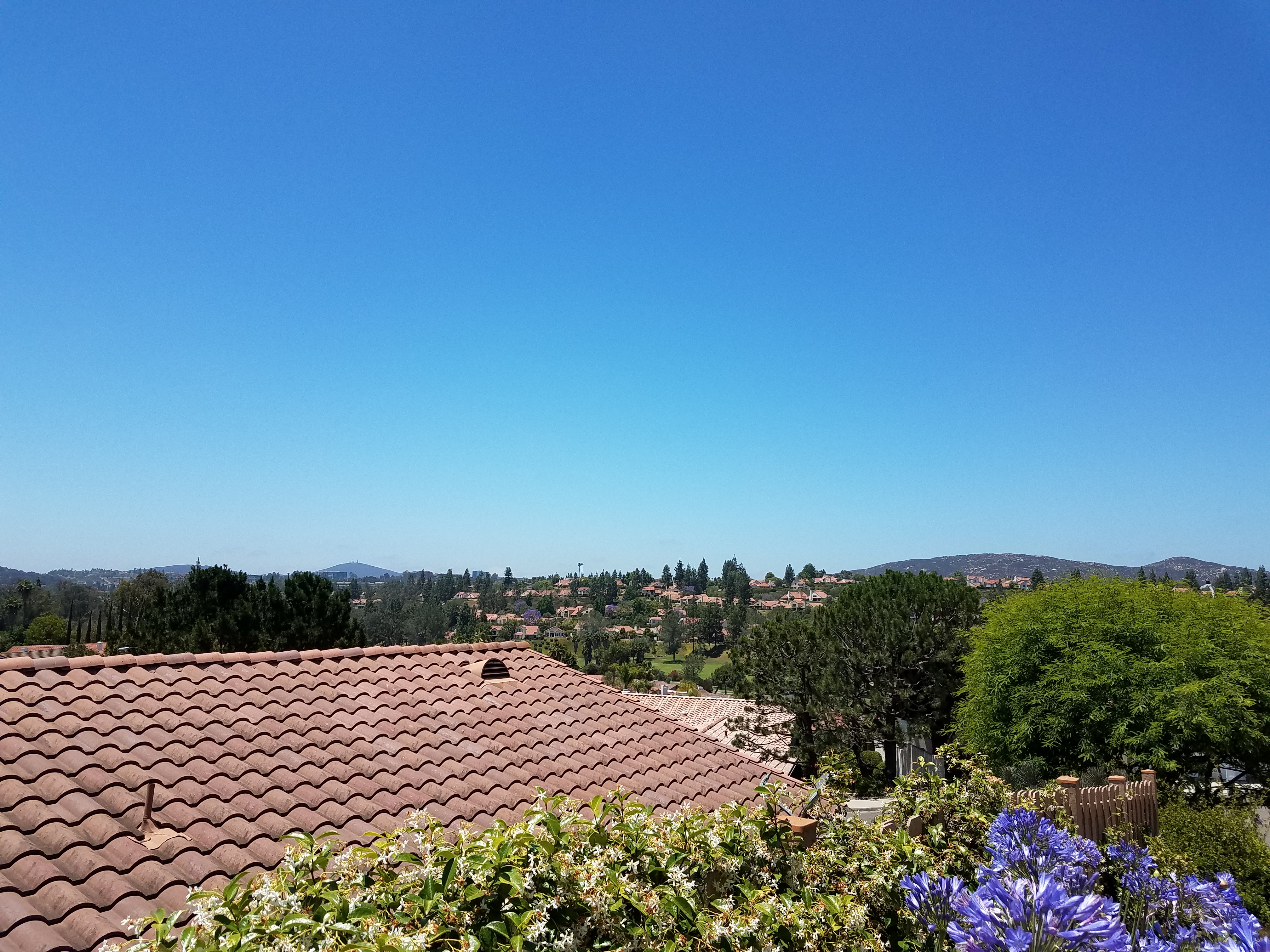 Panoramic view over suburban rooftops and hills in Rancho Bernardo, San Diego.