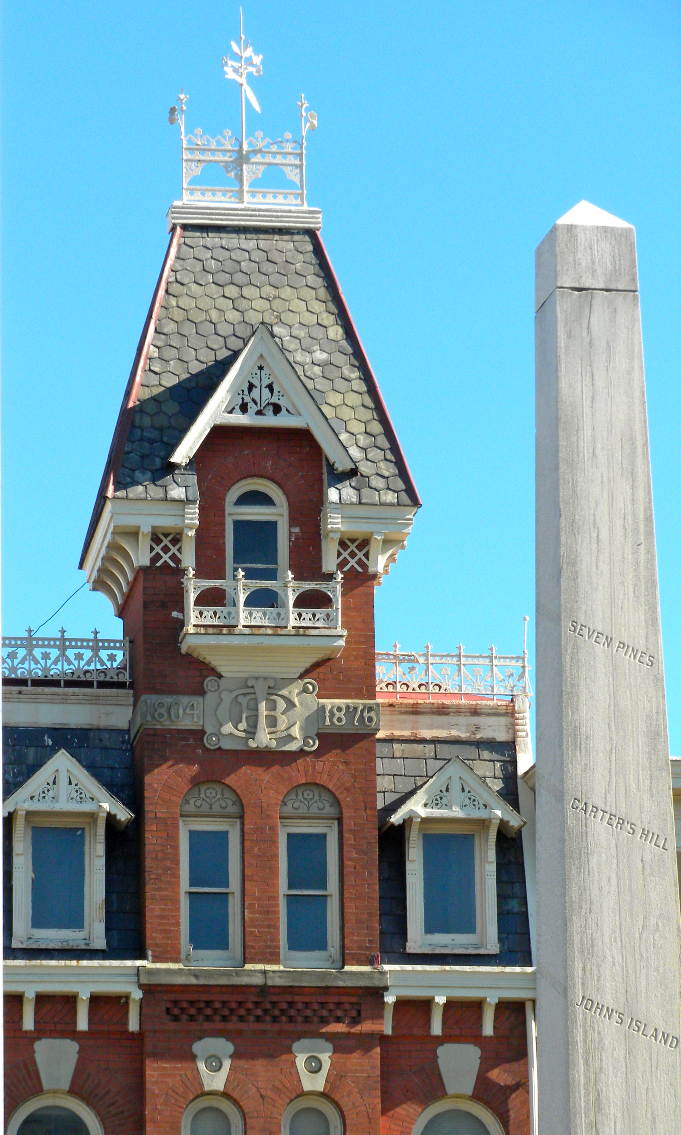 Victorian red brick building and Civil War obelisk monument in downtown Doylestown, Pennsylvania.