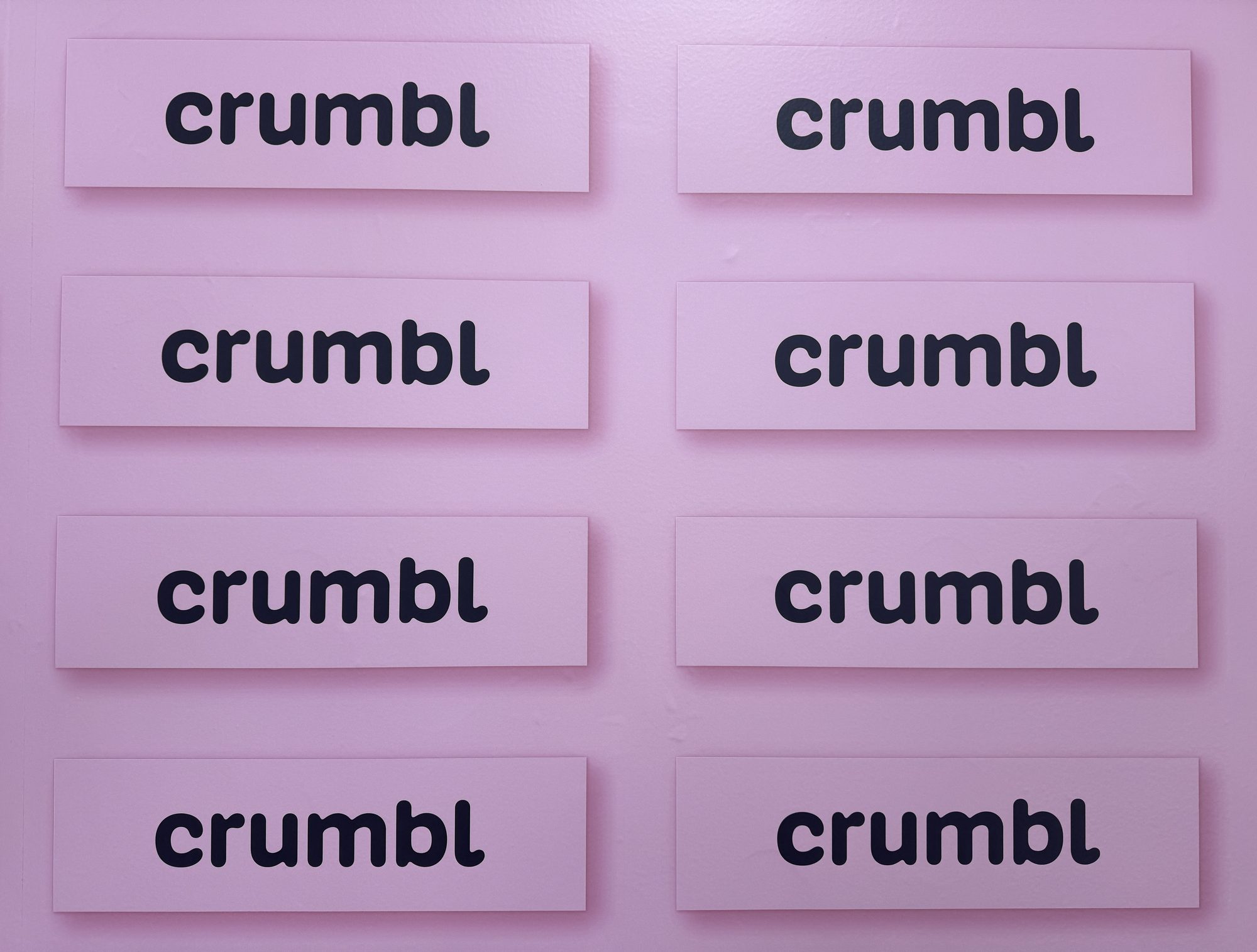 Wall of Crumbl signs at Crumbl Cookies in Novato, California