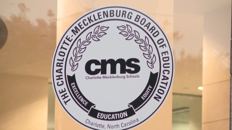 Circular official seal reading Charlotte-Mecklenburg Board of Education with CMS acronym at center.