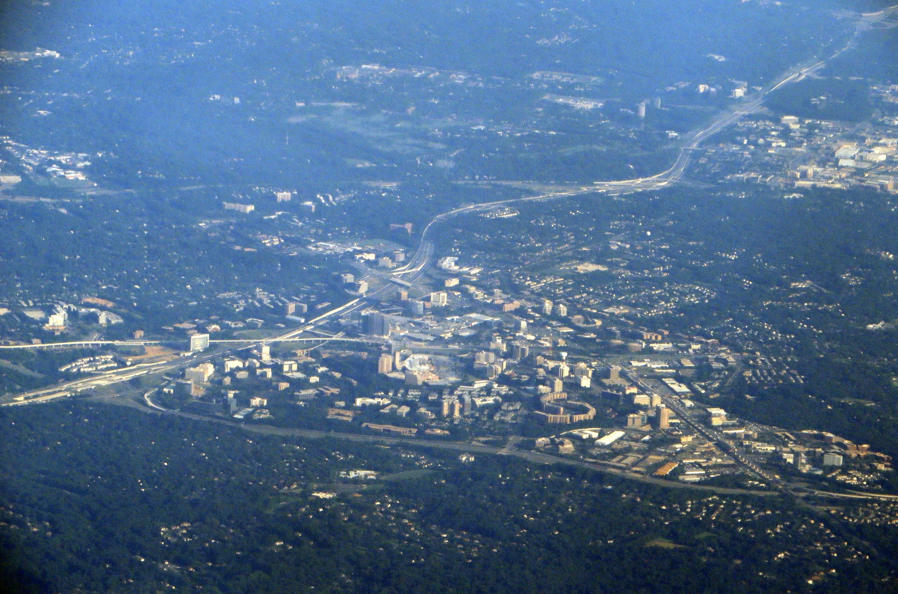 Aerial view of office buildings, highway interchanges, and suburban neighborhoods in Northern Virginia.