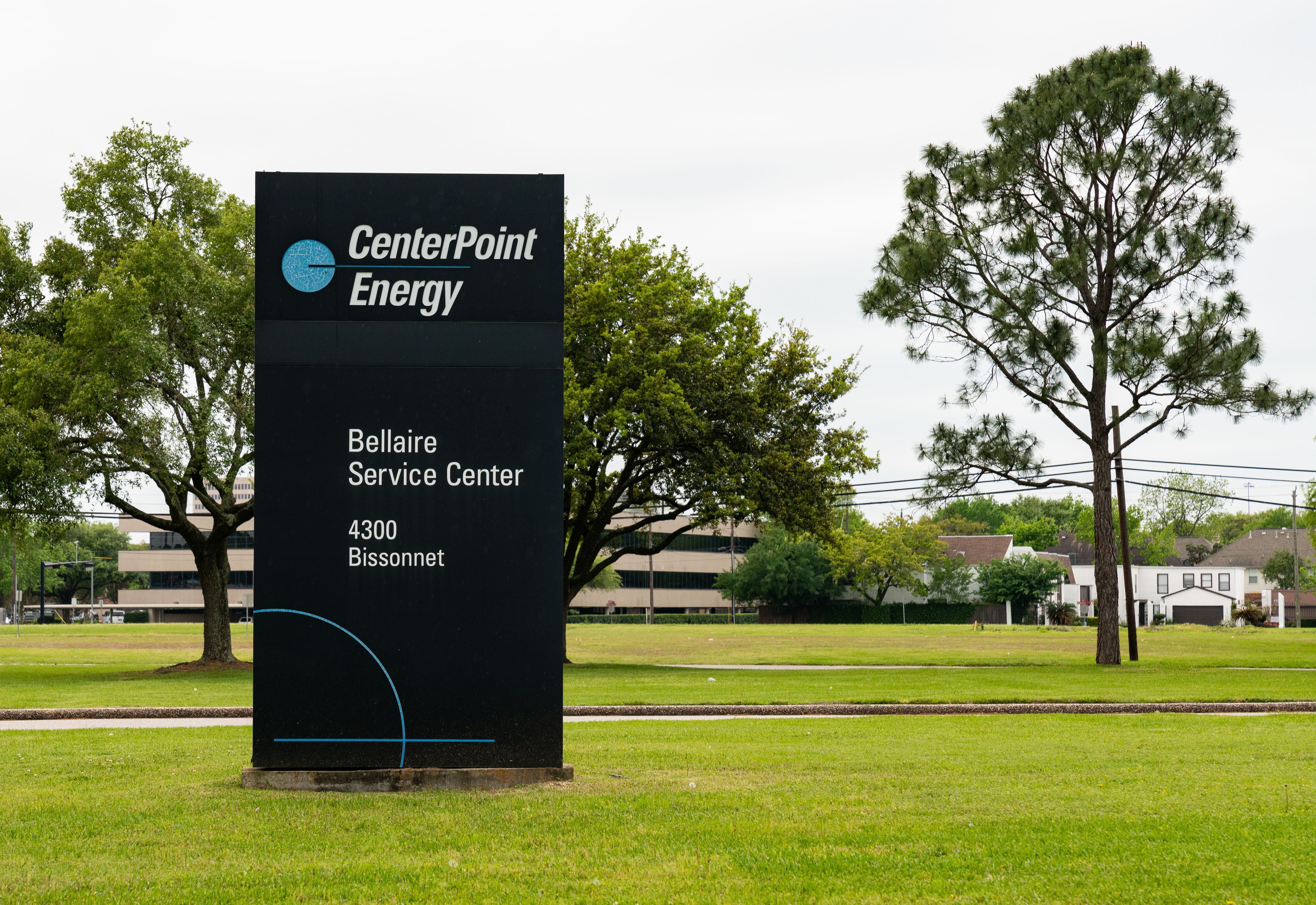 Monument sign reading CenterPoint Energy Bellaire Service Center on a green lawn