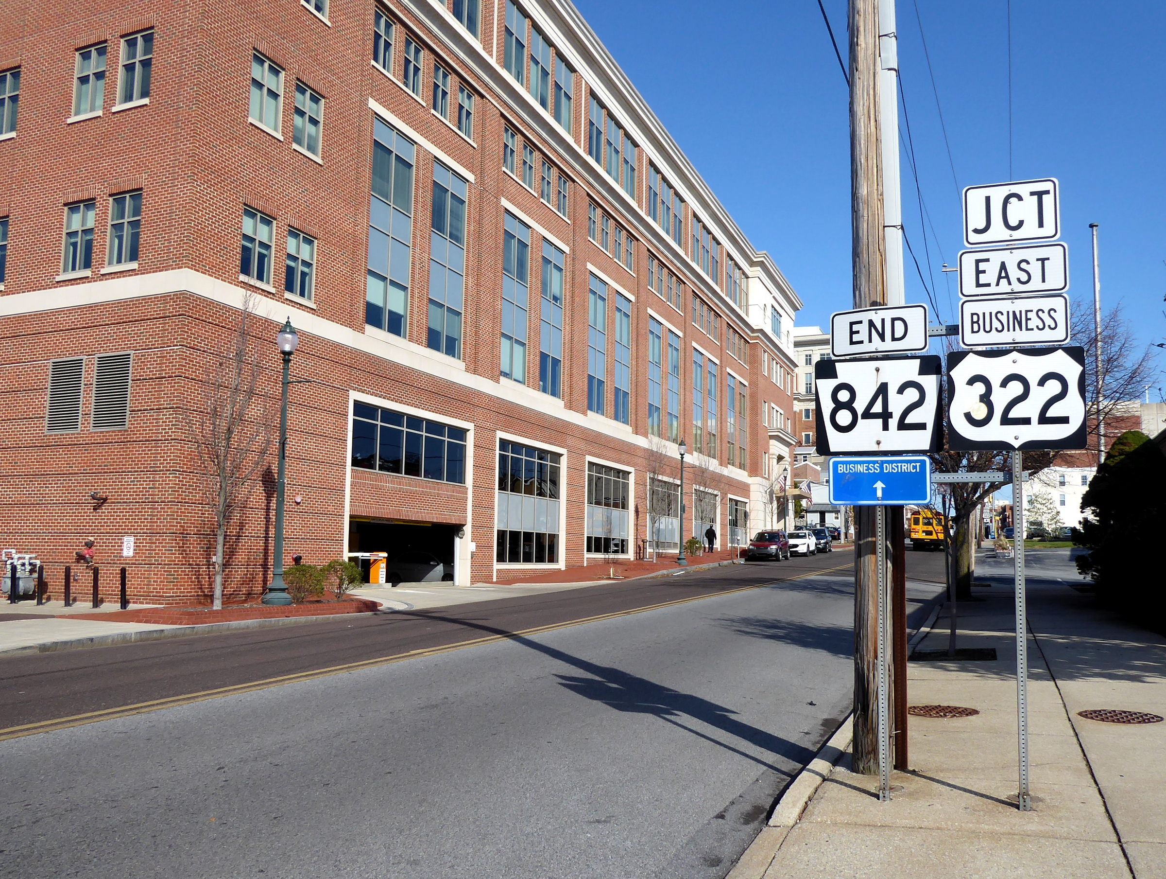 Street intersection with highway route signs in downtown West Chester, Pennsylvania.
