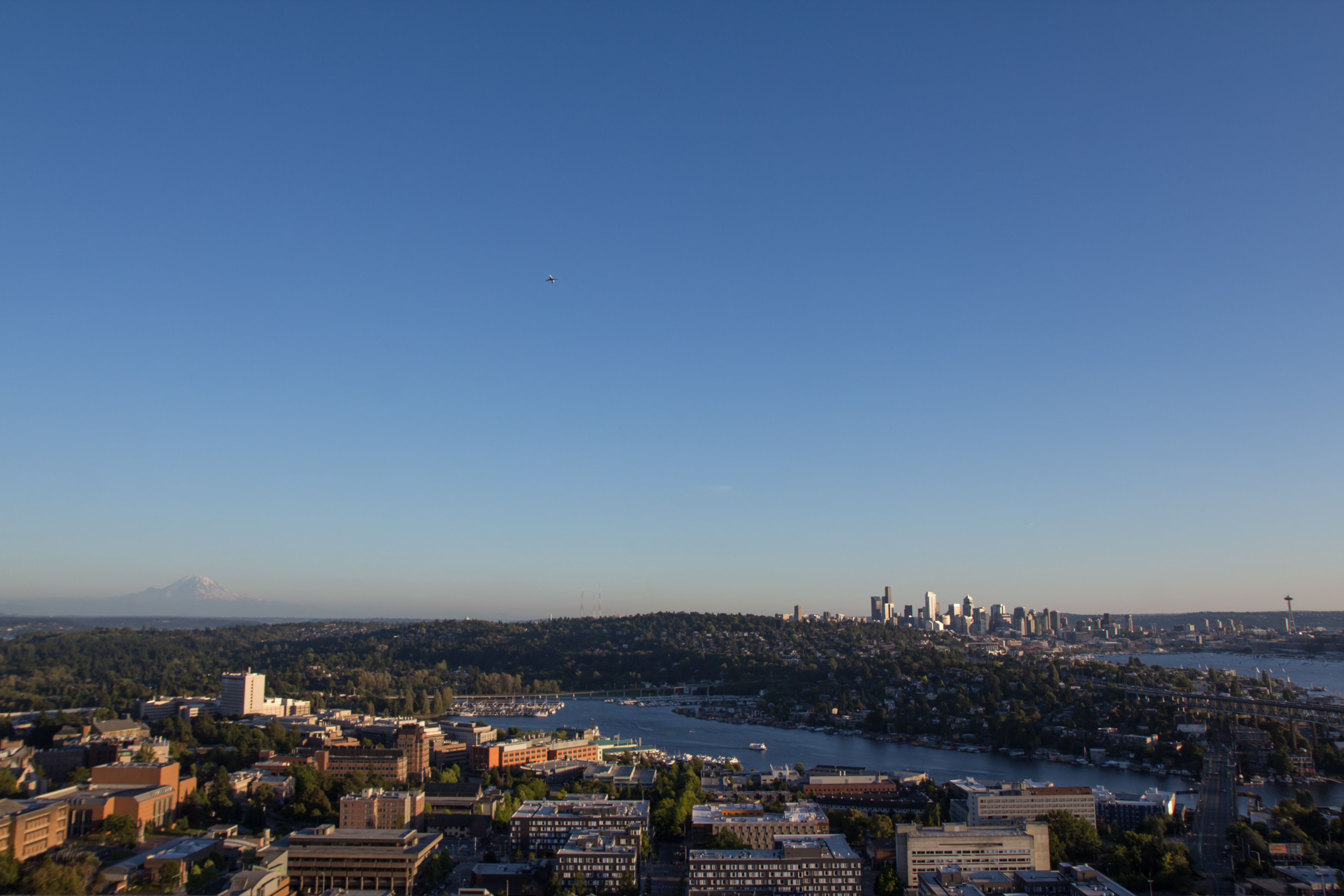 Aerial panorama of Seattle showing Lake Union, urban neighborhoods, and the downtown skyline.