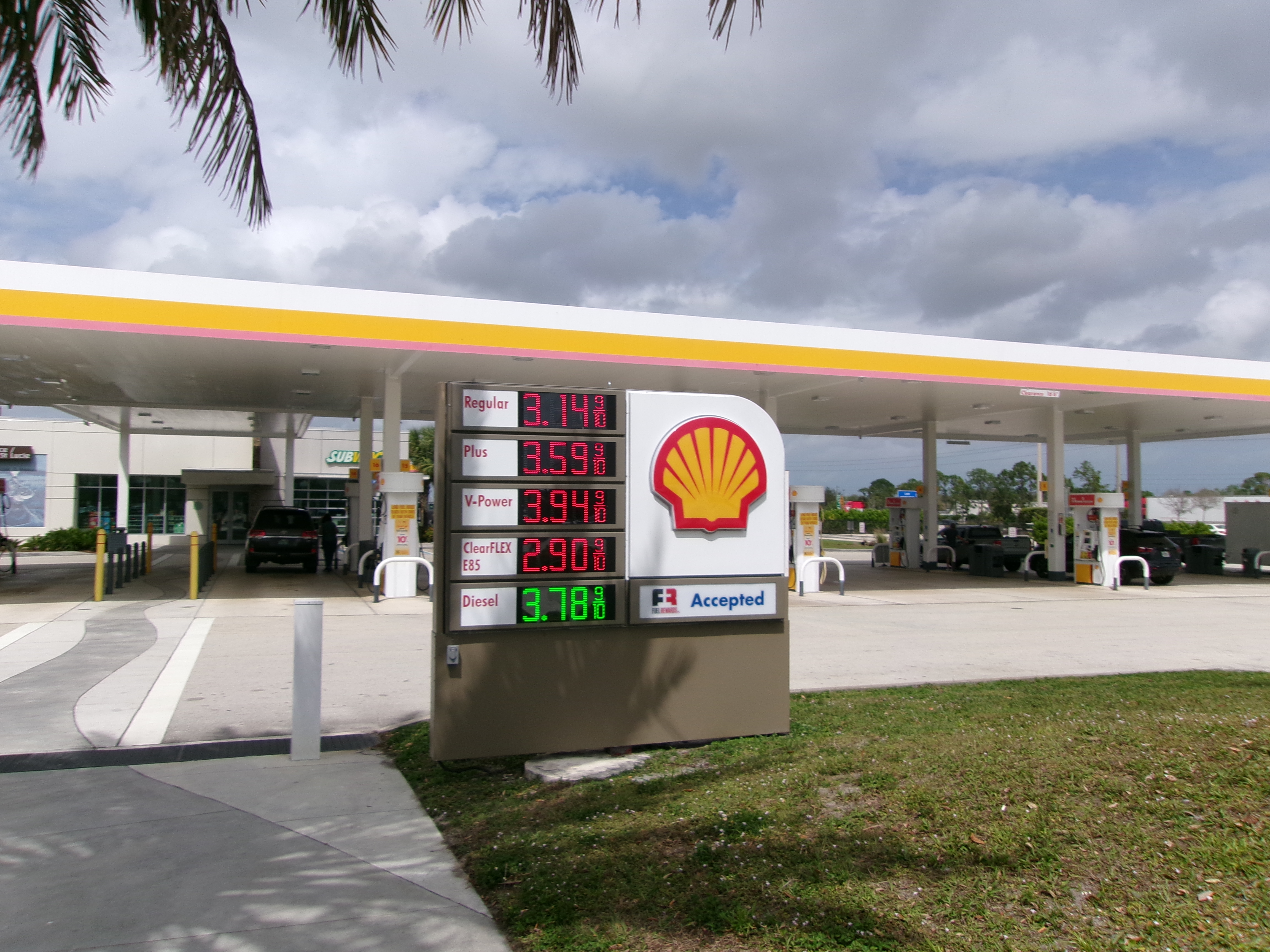 Close-up of a gas station sign showing per-gallon prices for several fuel grades.