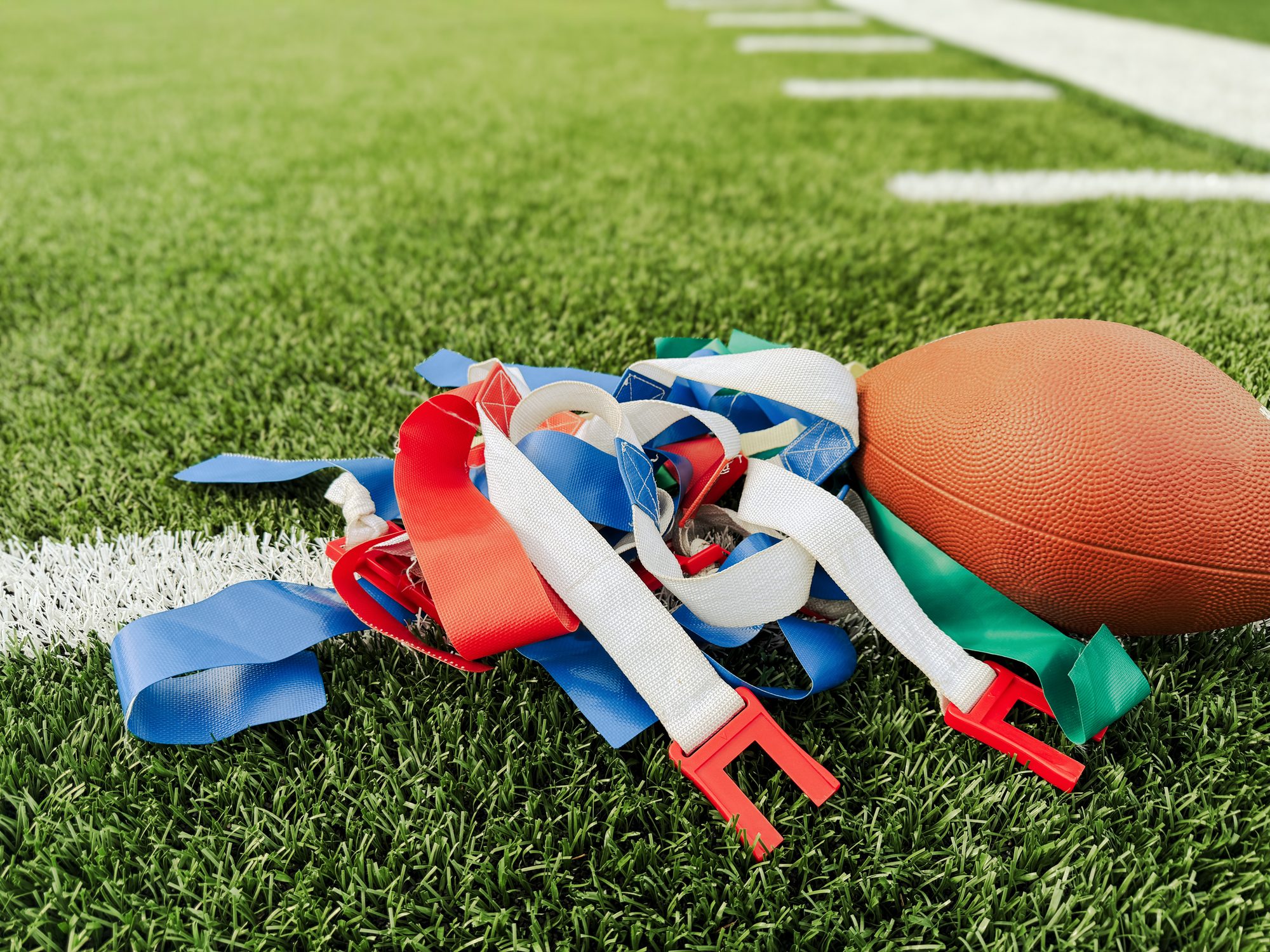 Flag Football Equipment on Green Turf Football Field