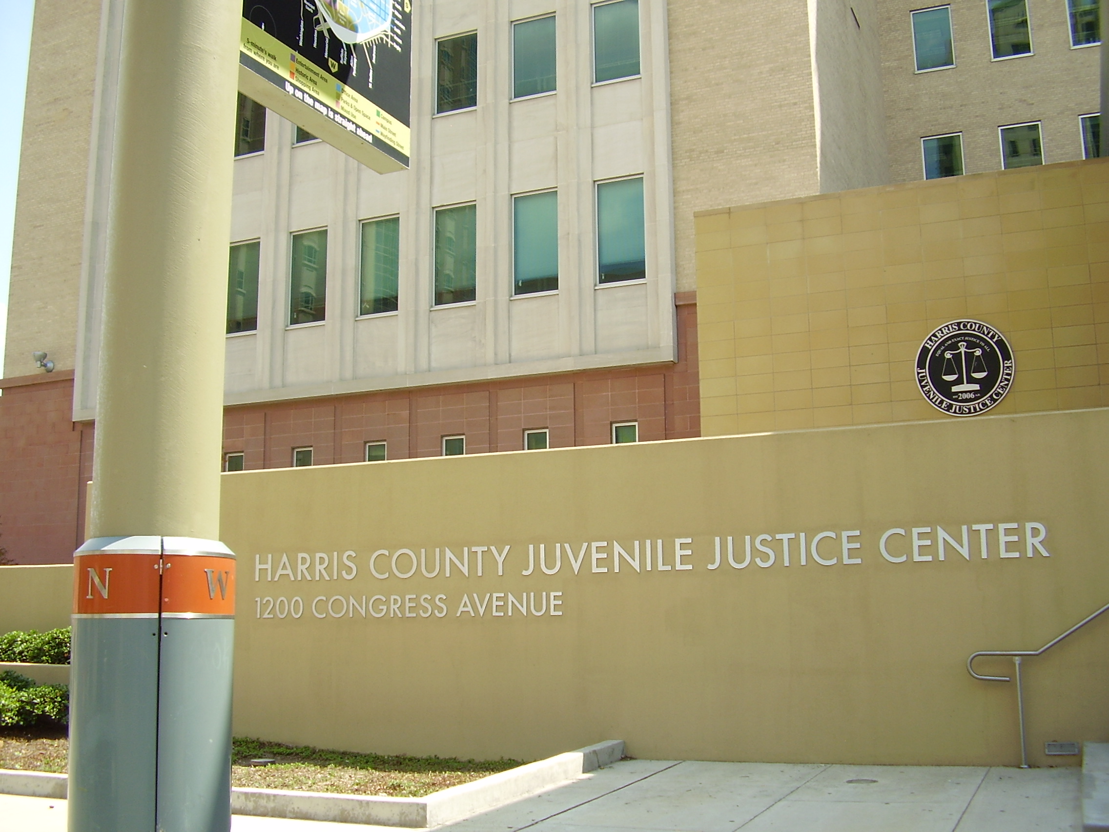 Exterior sign reading Harris County Juvenile Justice Center at 1200 Congress Avenue.