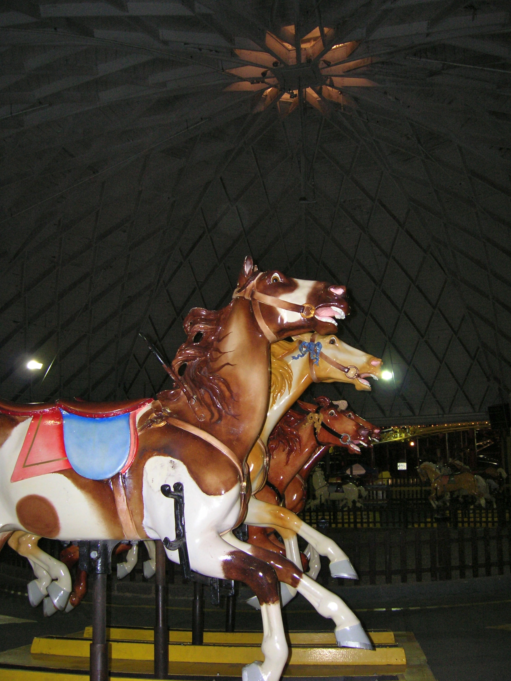 Carousel horses inside a domed structure at Playland Amusement Park.