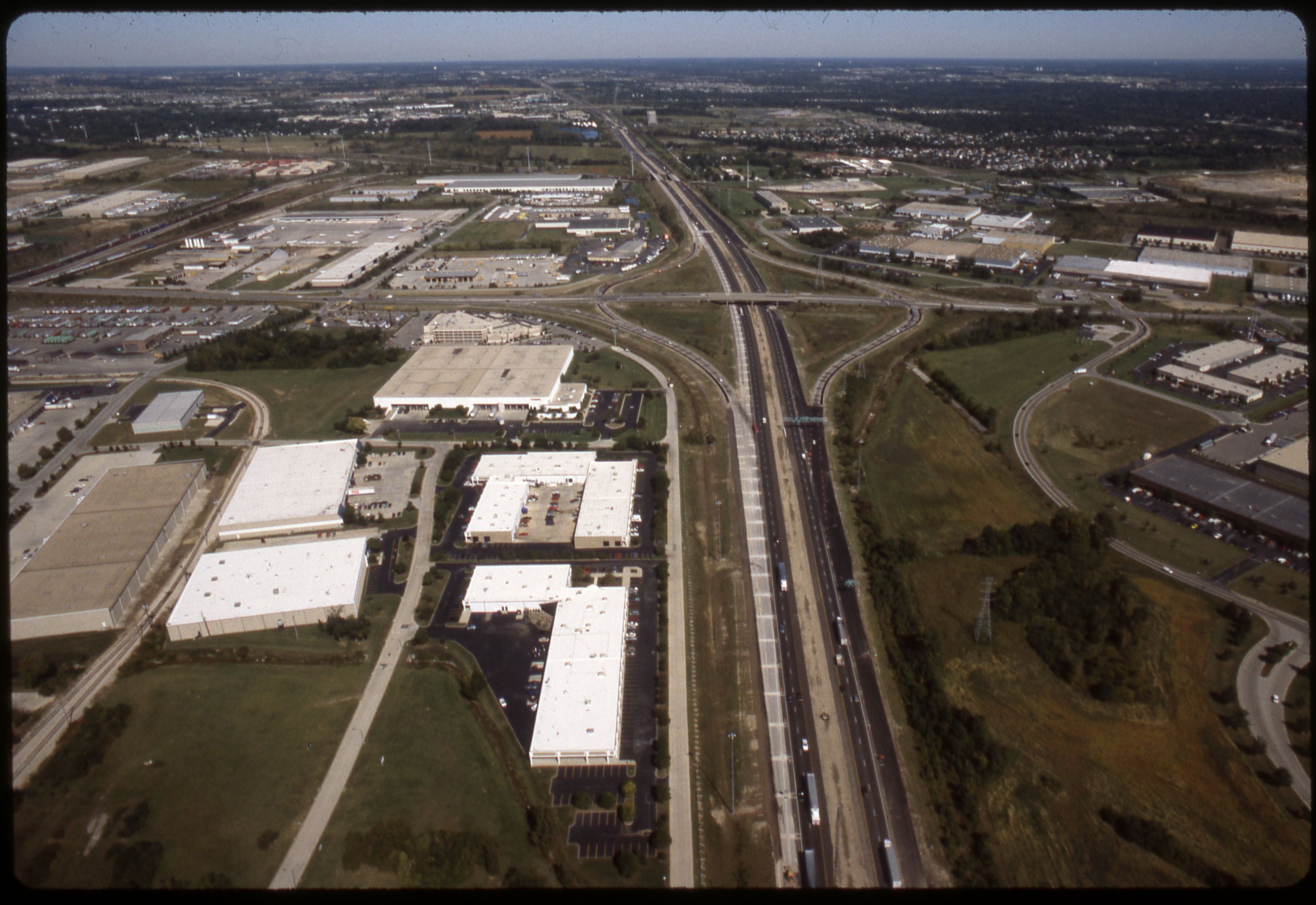 Aerial view of Roberts Road crossing over Interstate 270 with commercial buildings nearby.