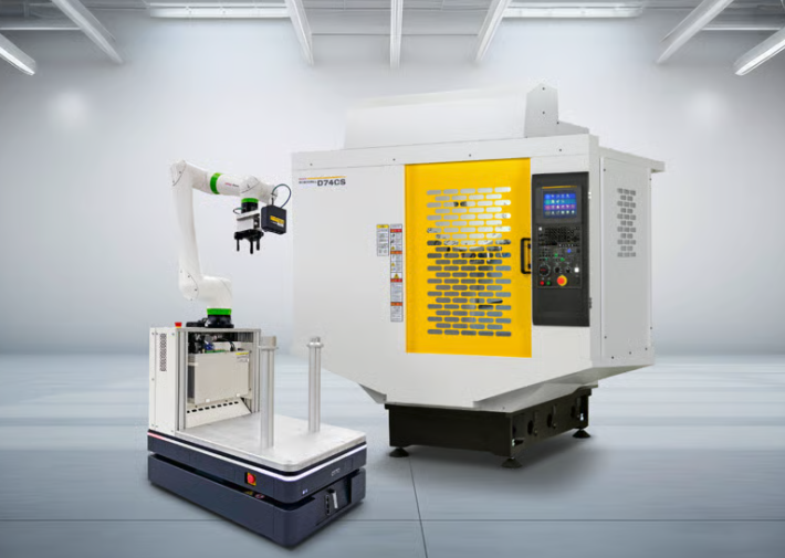 FANUC's D74CS ROBODRILL machining center next to a collaborative robot arm mounted on an autonomous mobile robot platform, as featured in the company's IMTS 2026 announcement.