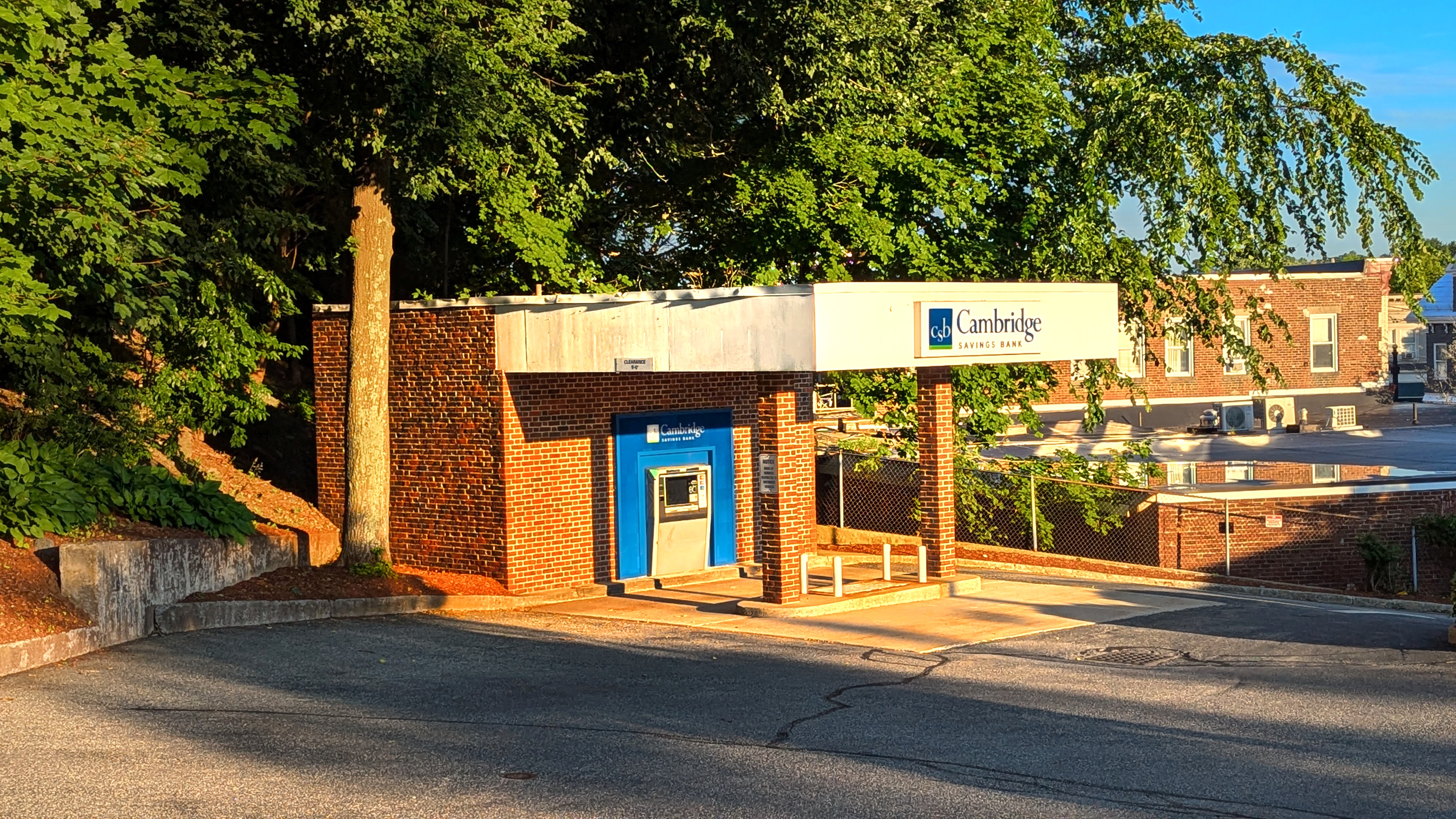 A small brick Cambridge Savings Bank branch building with a blue drive-through ATM kiosk.