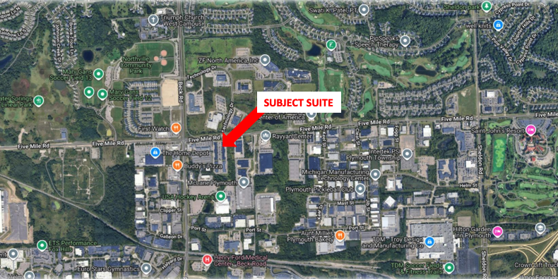 Aerial map with a red arrow labeled "Subject Suite" pointing to a building on Five Mile Road in Andover Business Park, surrounded by nearby businesses and roads.