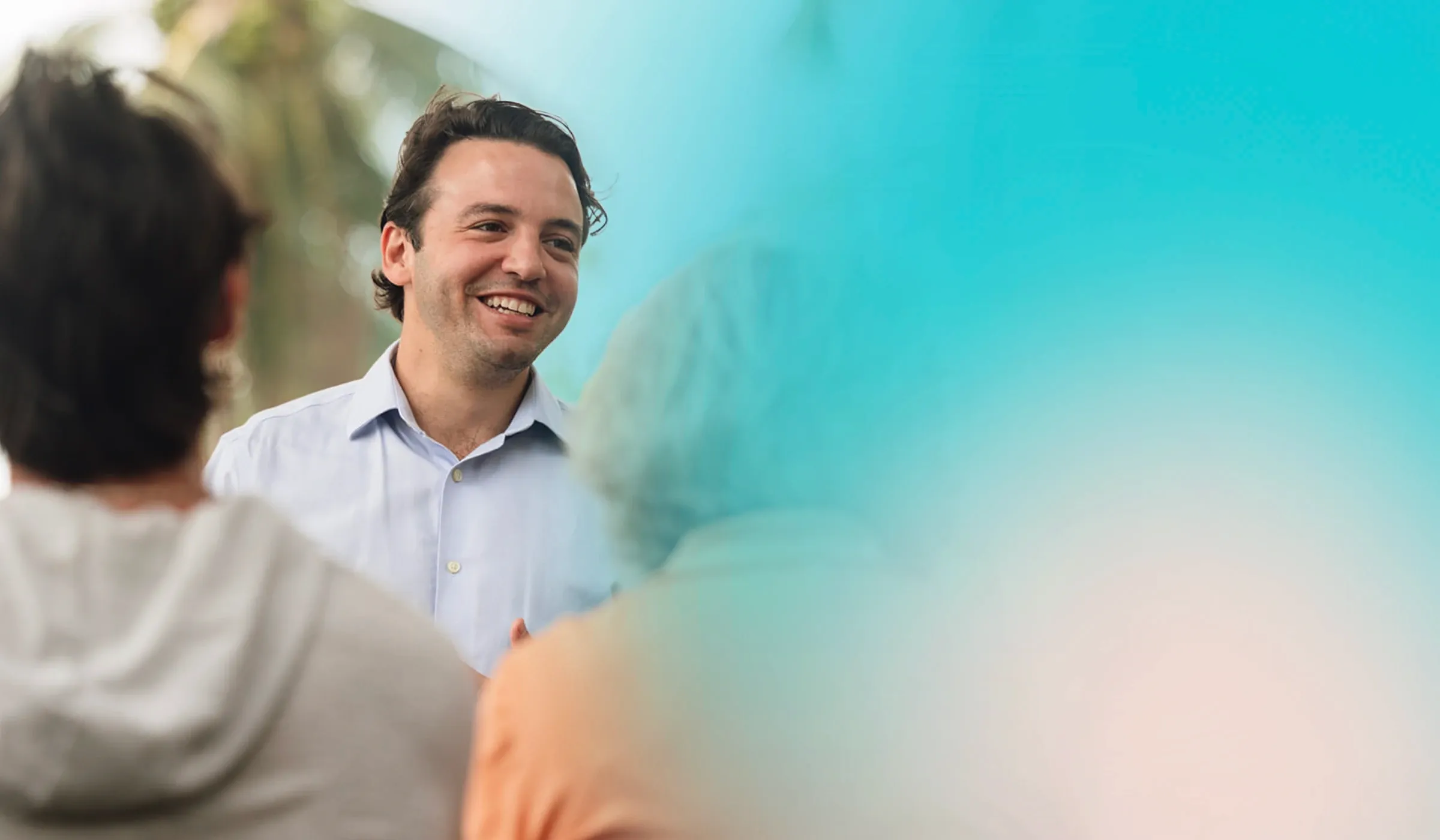 Richard Lamondin speaking with people in a campaign photograph.