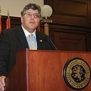John Ciampoli speaking at a lectern