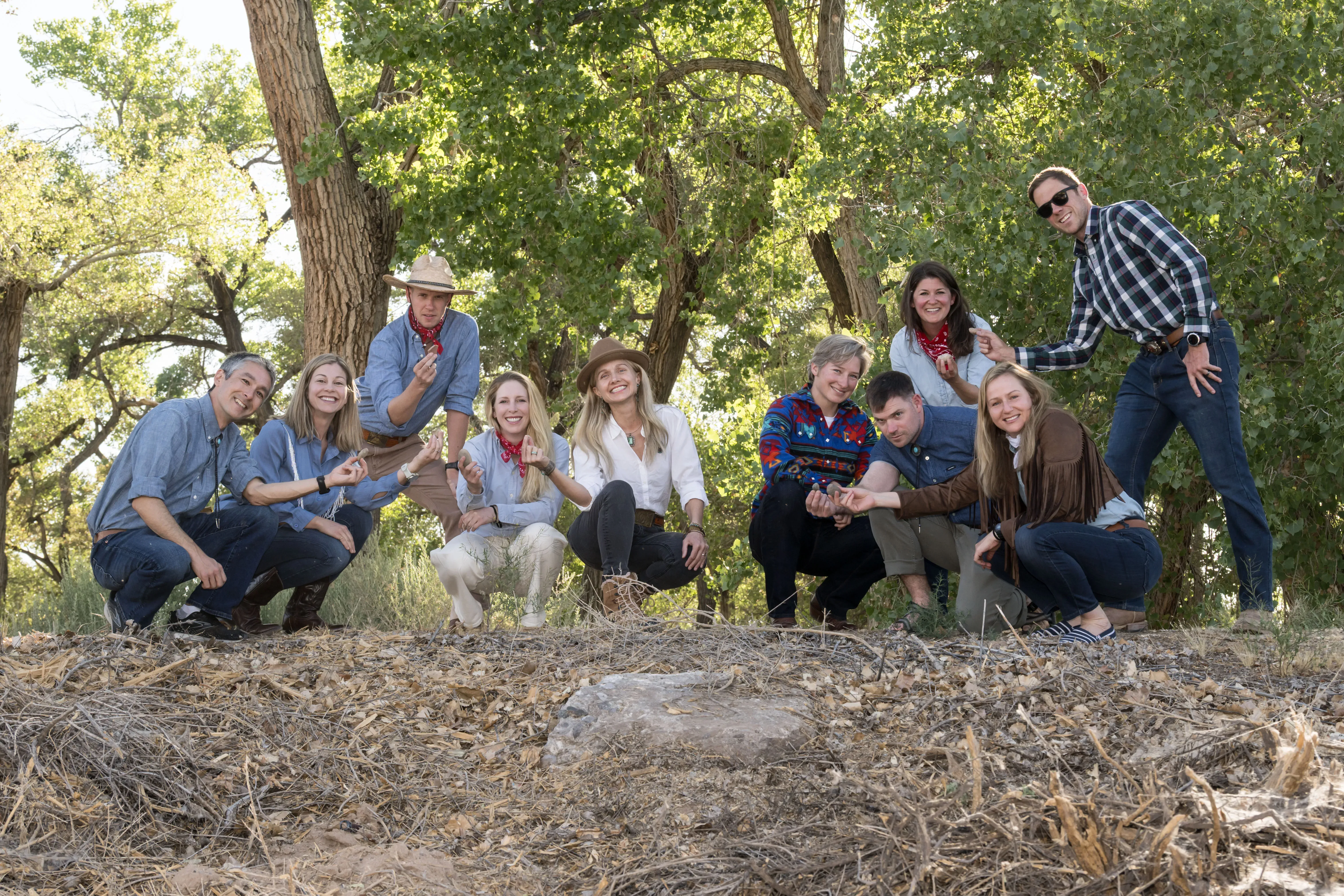 The members of NASA’s 2025 Astronaut Candidate Class pose with rock samples collected during their geology training at the Rio Grande del Norte National Monument, New Mexico, in May 2026.