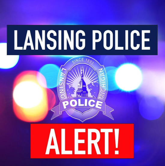 Lansing Police Department alert graphic showing the department badge over flashing police lights.