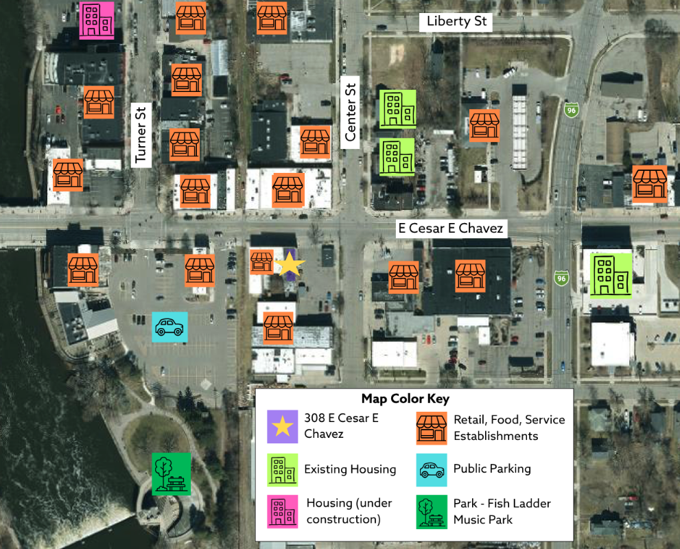 A satellite map of Lansing's Old Town, marking 308 E. Cesar E. Chavez Avenue with a star and color-coding nearby retail businesses, existing and under-construction housing, public parking and Fish Ladder Park.