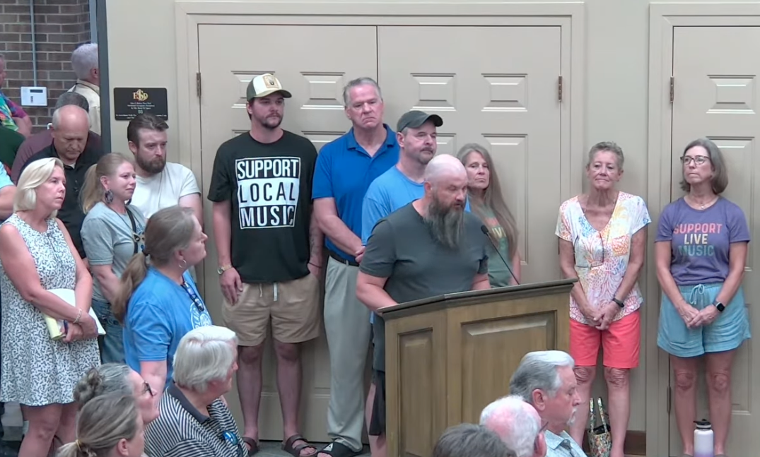 crowded city council meeting