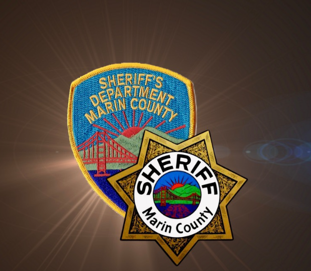 Marin County Sheriff’s Department shoulder patch behind a gold sheriff’s badge.