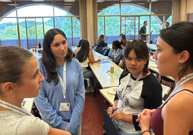 Students wearing SEAP lanyards talk together during a Student Elections Ambassador Program event at the Marin County Civic Center.