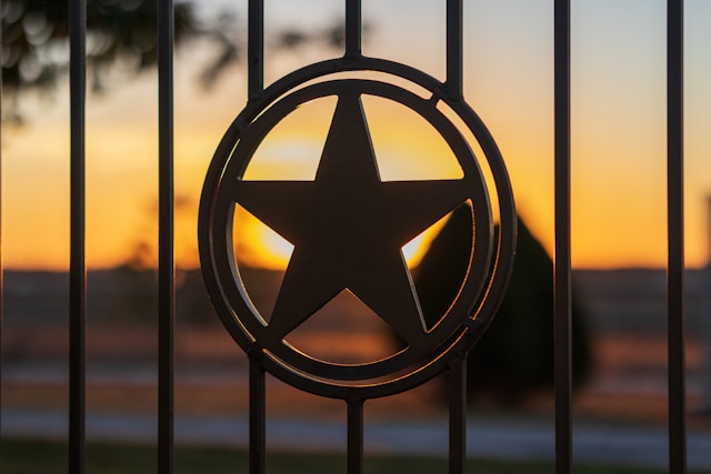 a metal fence with a star emblem