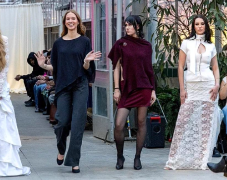 Student models walk a runway inside the MSU Horticulture Gardens greenhouse during the first Studio 450 Fashion Show.